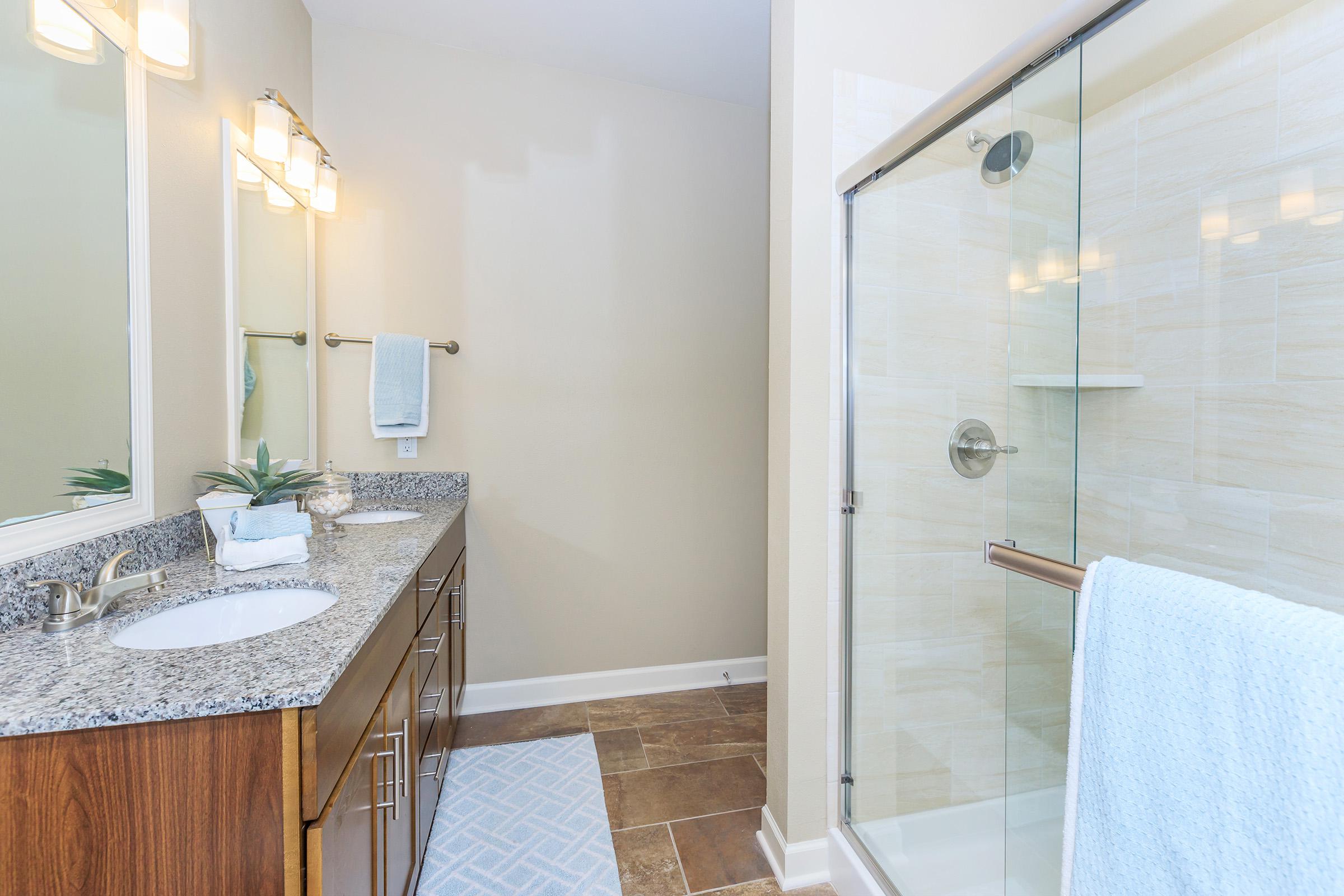 a room with a sink and a shower