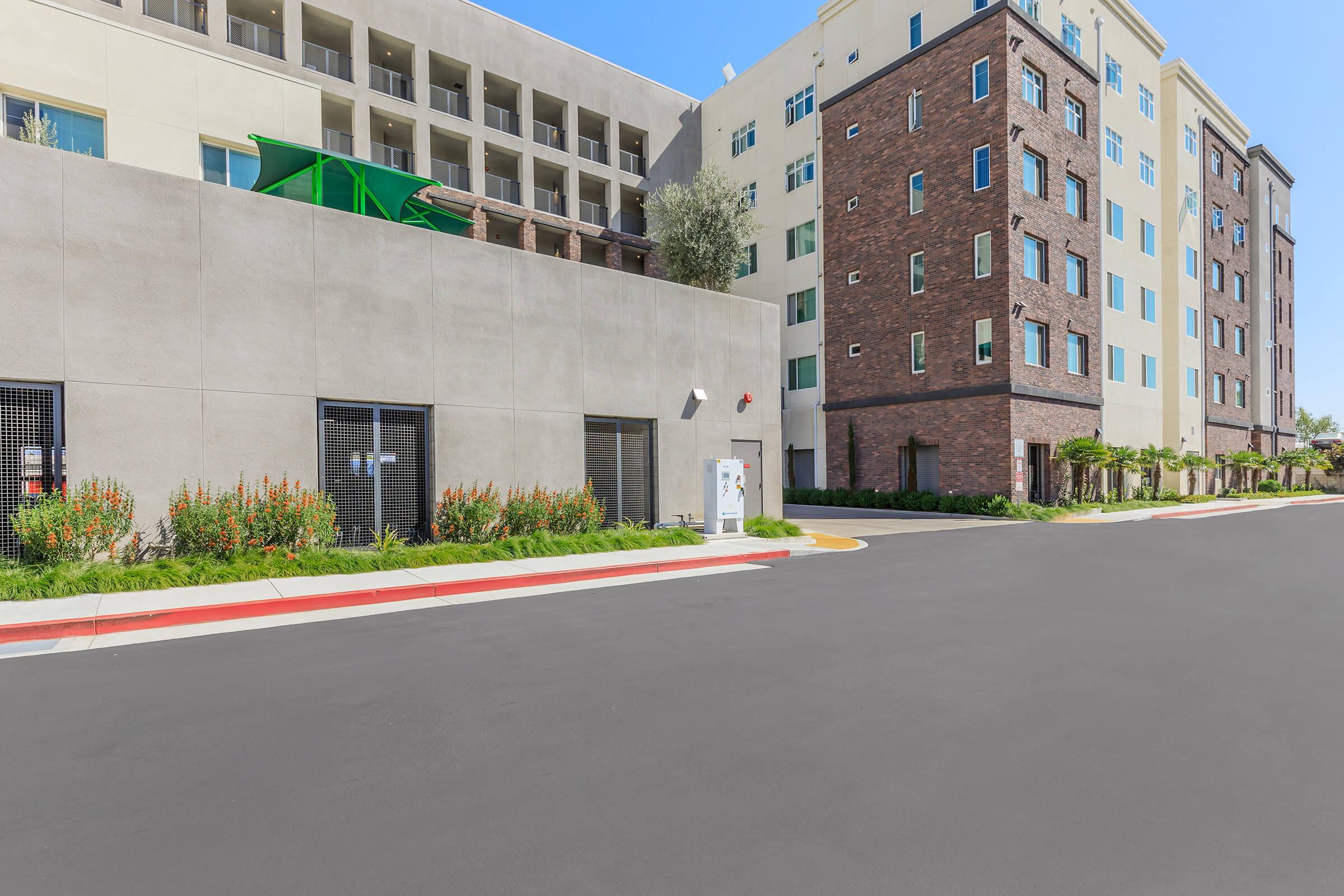 a road with a building in the background