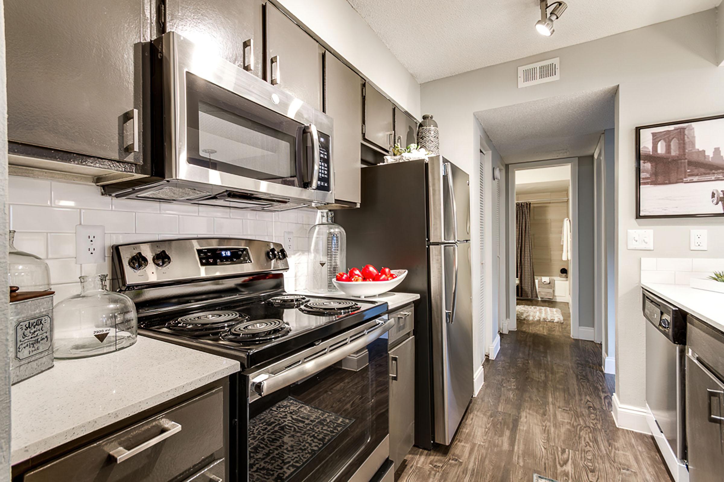 a kitchen with a stove and a sink