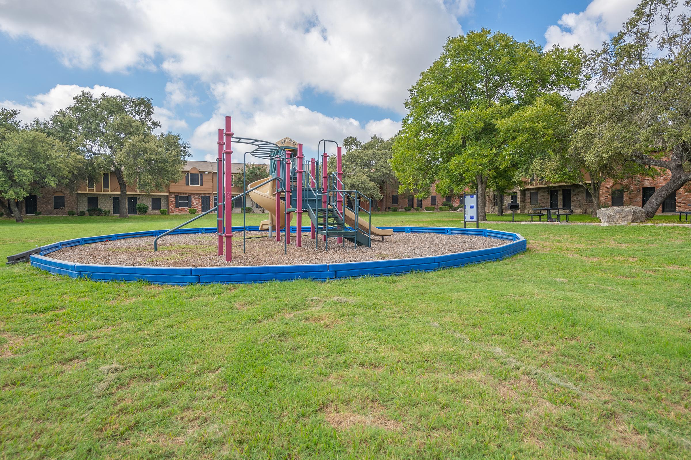 a playground in a grassy field