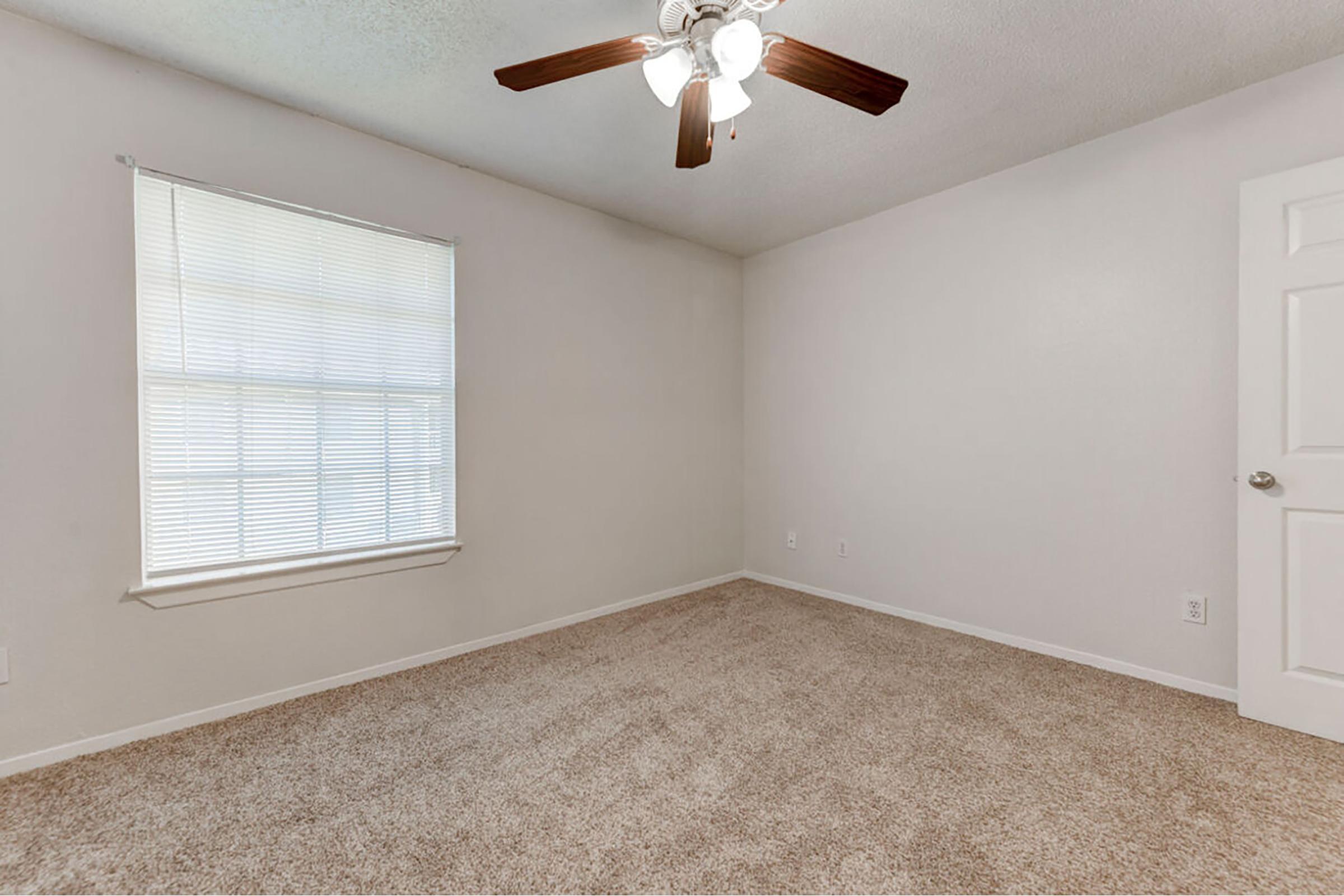 a bedroom with a large window