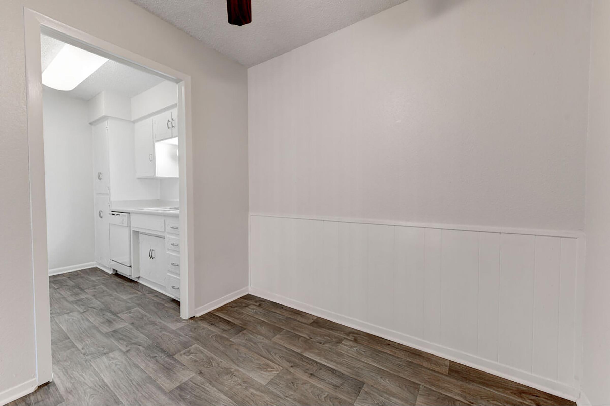 a kitchen with a sink and a refrigerator