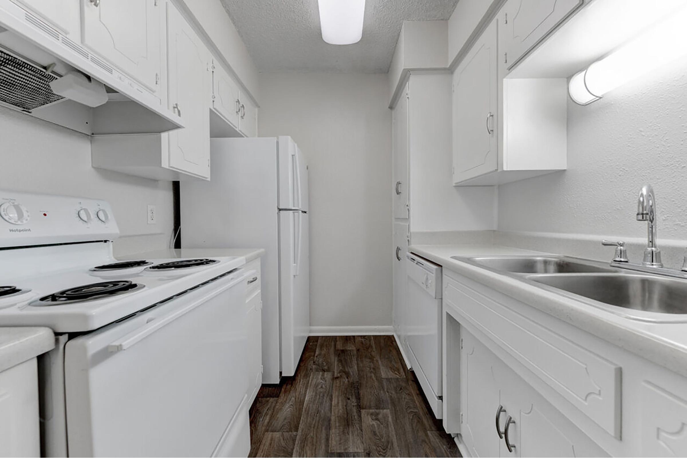 a kitchen with a stove and a sink