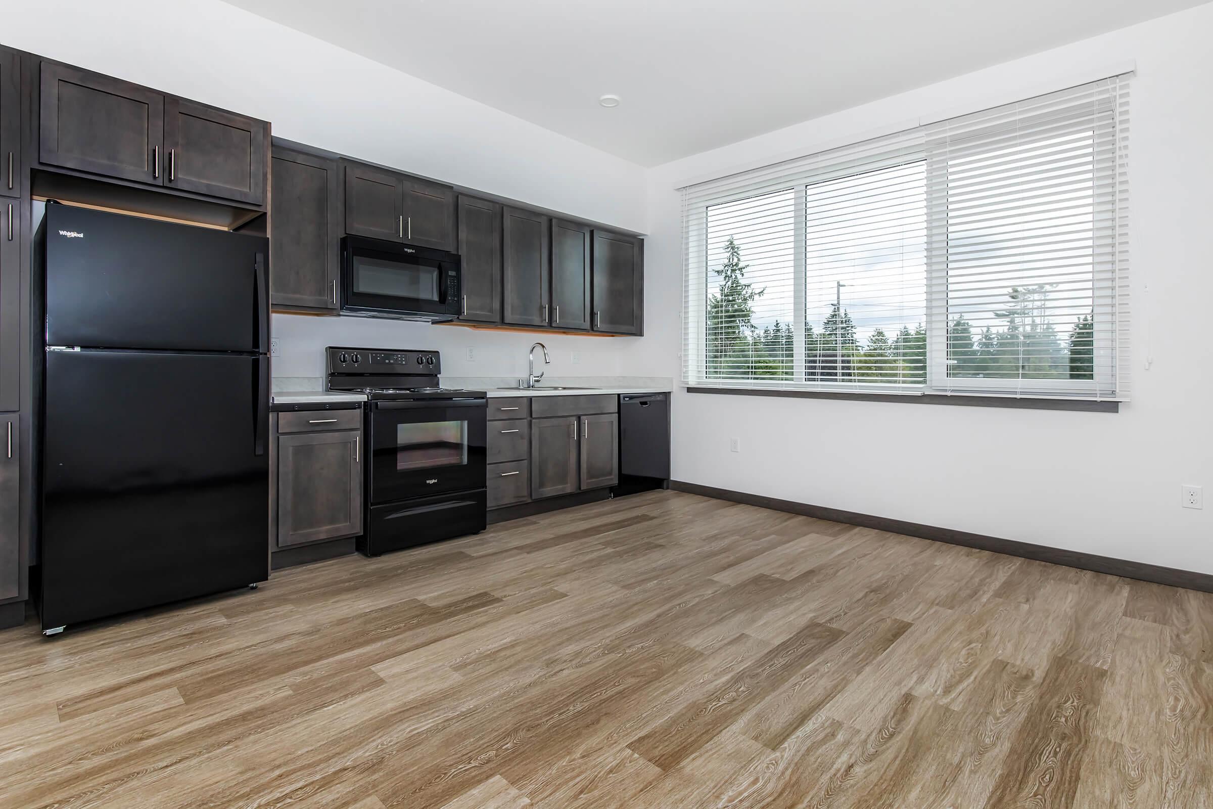 a kitchen with a large window