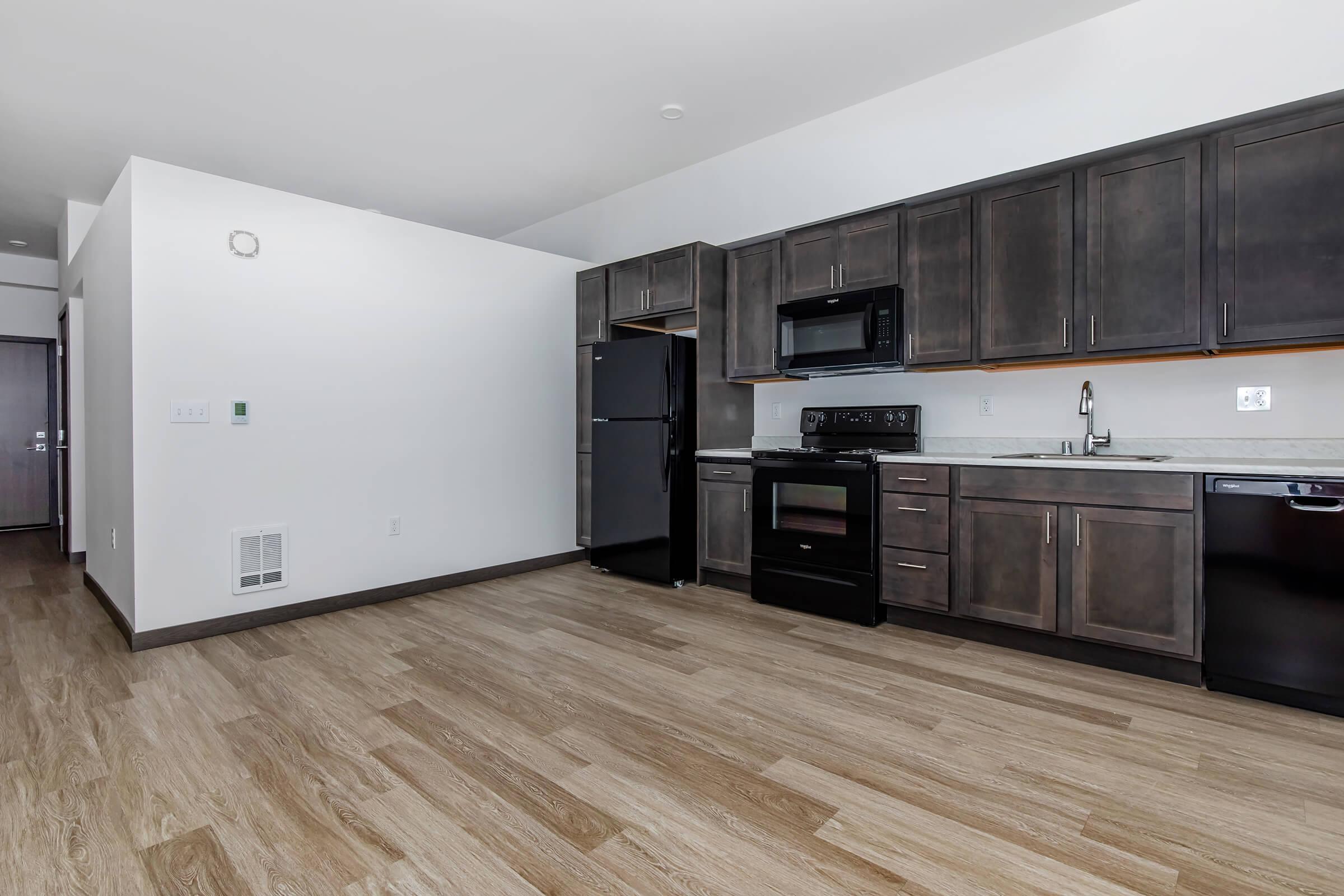 a large kitchen with stainless steel appliances