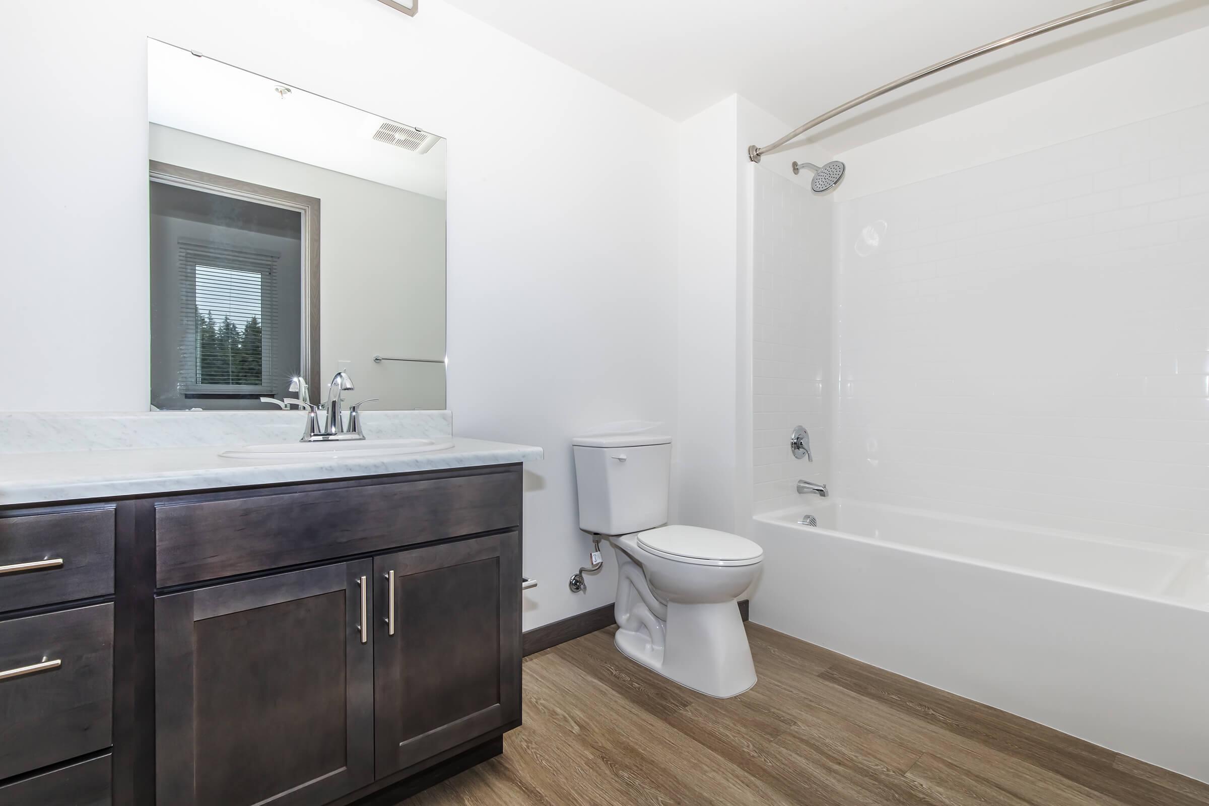 a large tub next to a sink