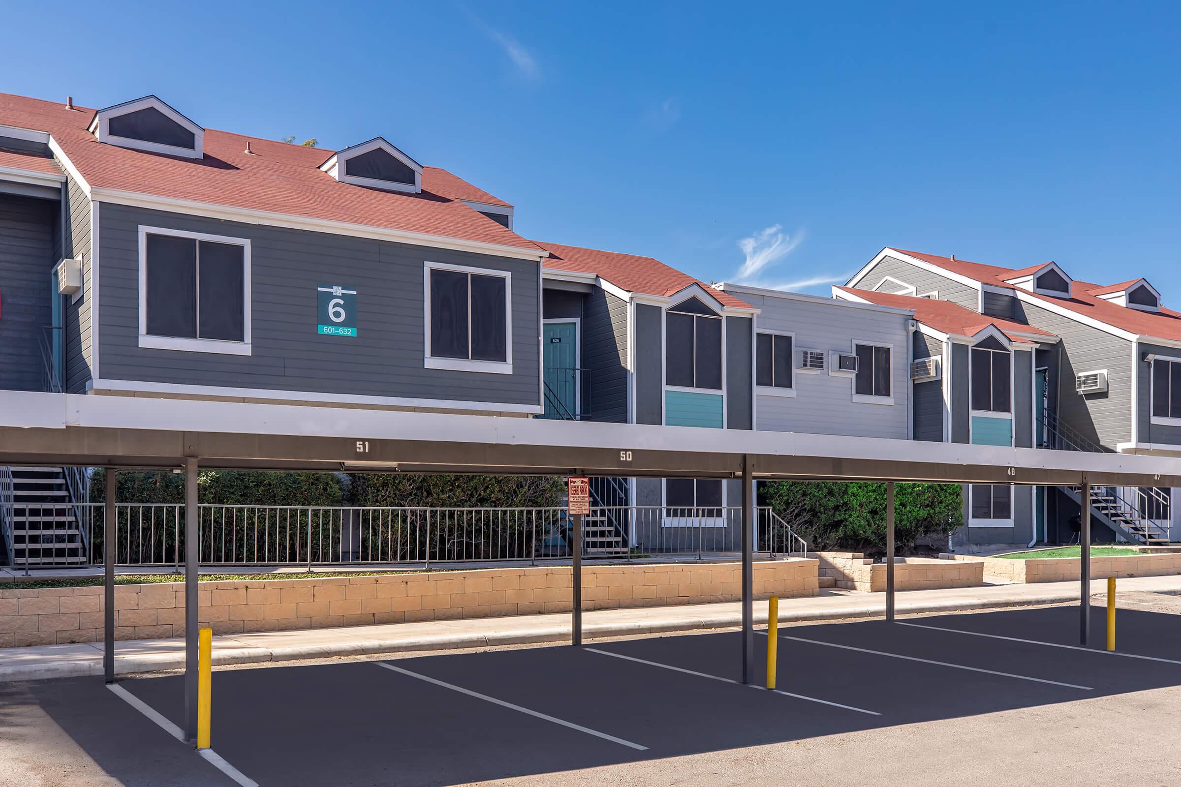 a train is parked on the side of a building