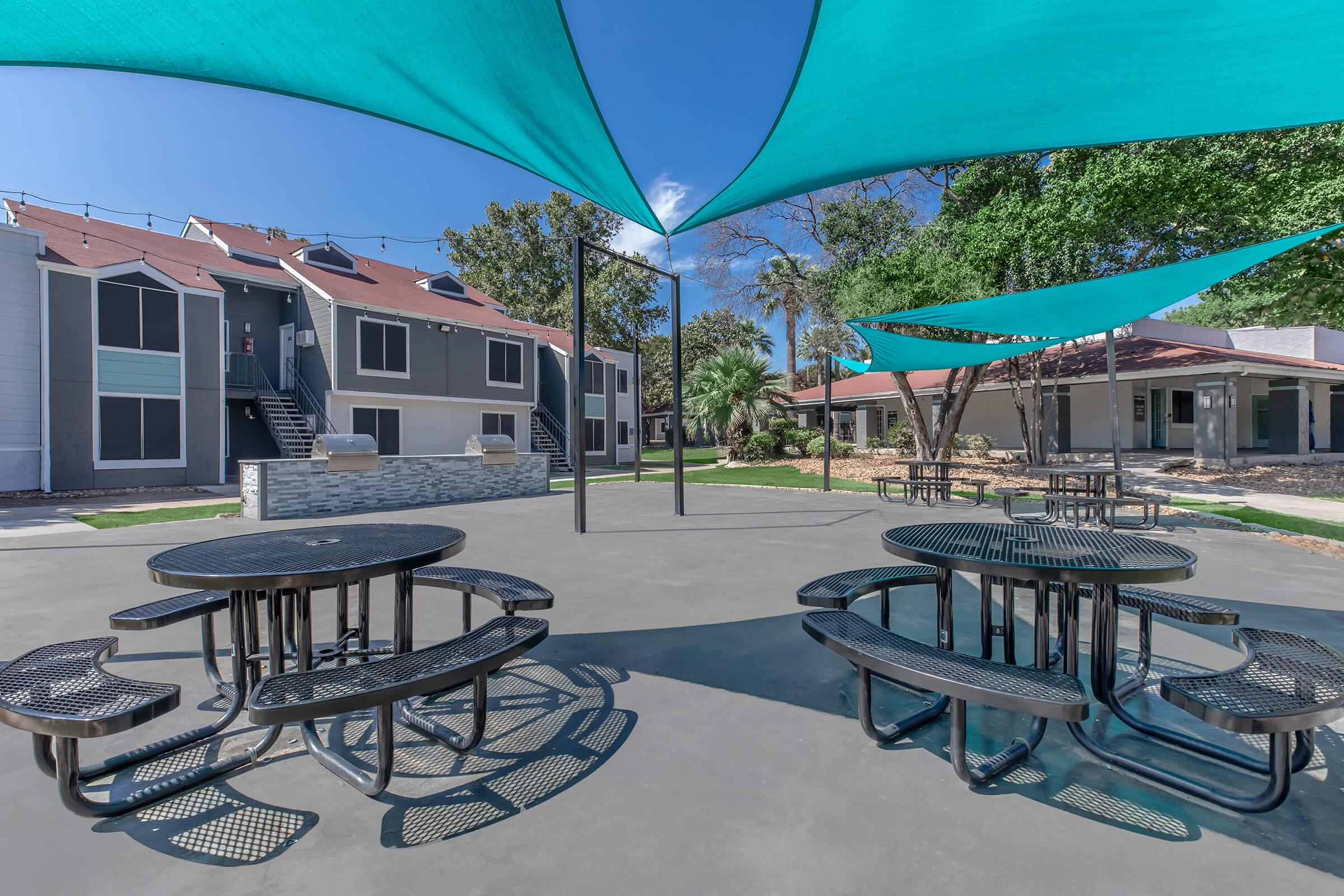 a table topped with a blue umbrella