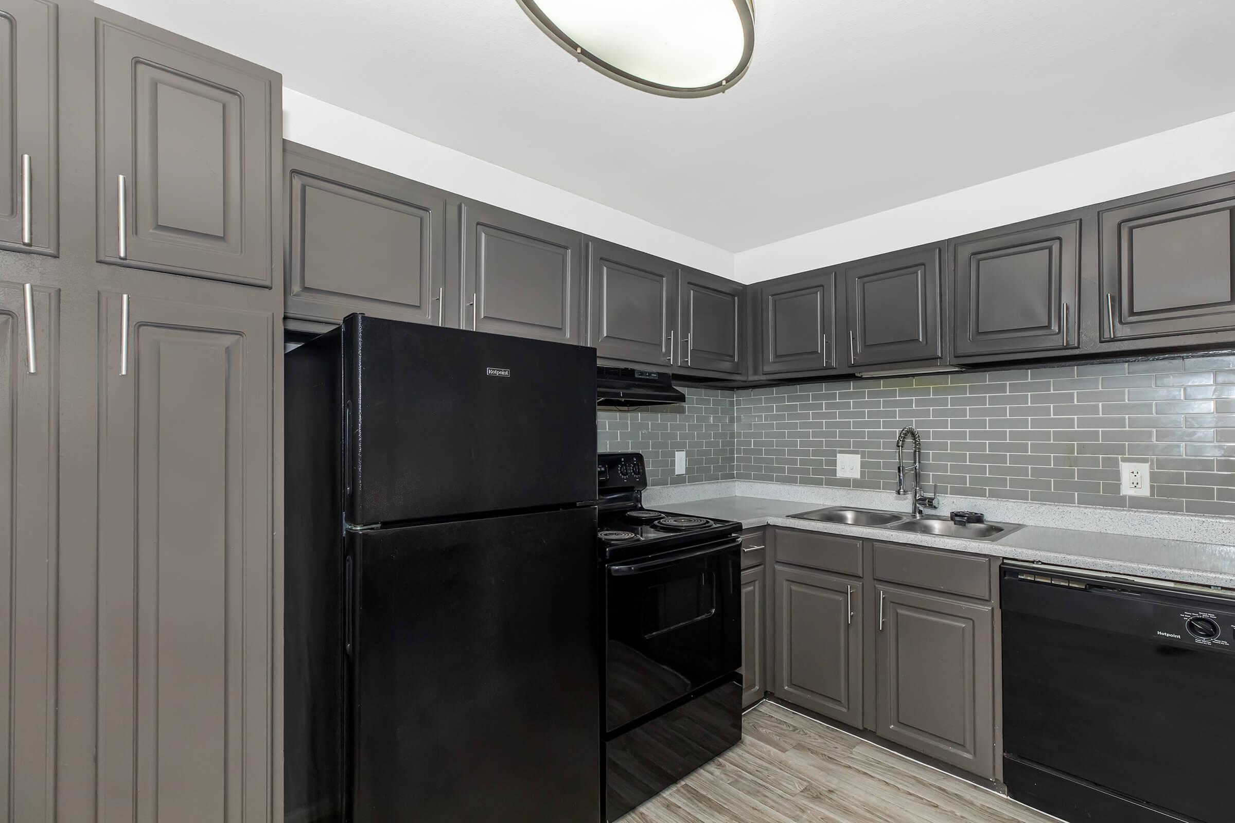 a large kitchen with stainless steel appliances