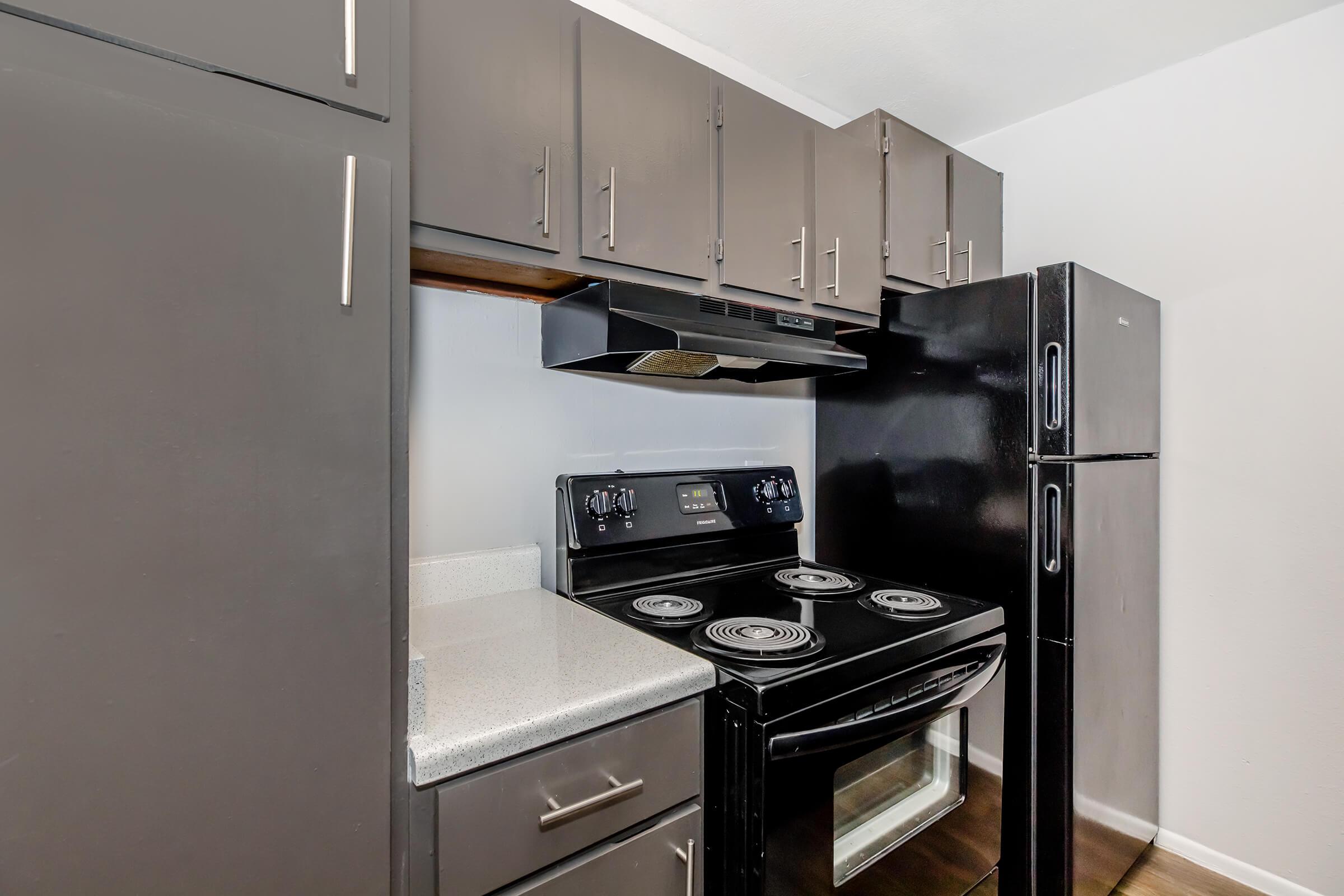 a kitchen with a stove top oven sitting inside of a refrigerator