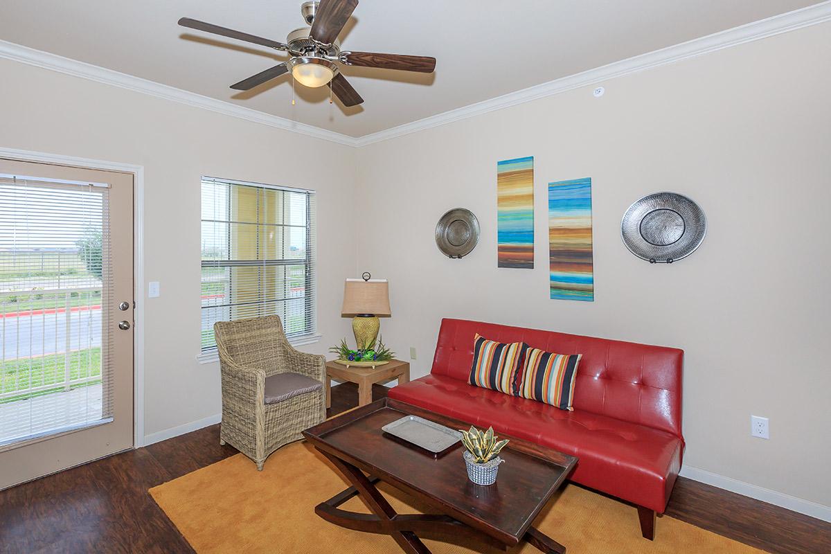 a large red chair in a living room