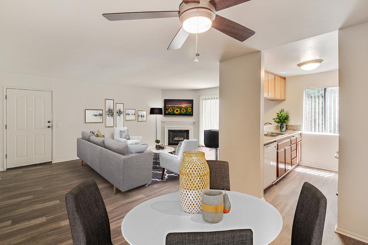 a living room filled with furniture and a flat screen tv