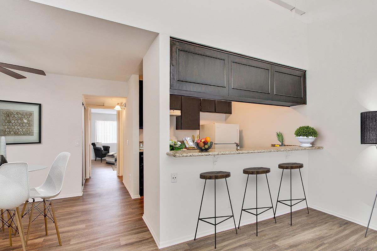 a living room filled with furniture and a flat screen tv