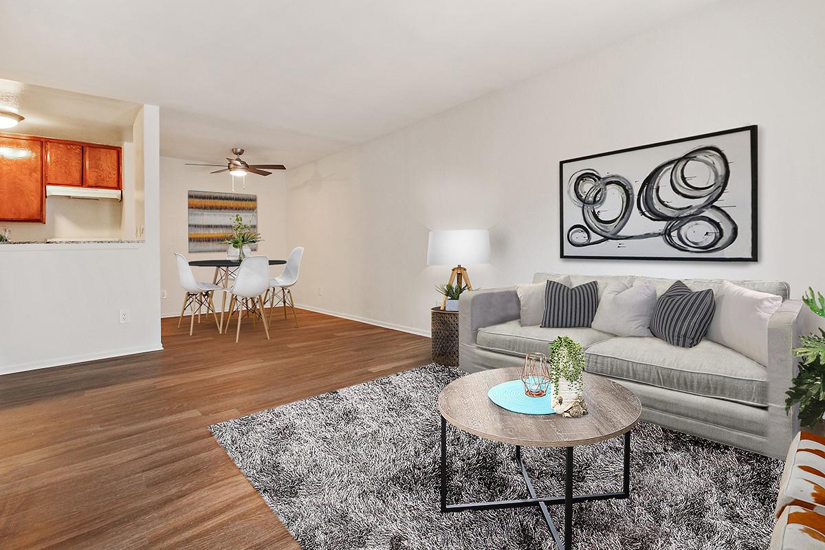 a living room filled with furniture and a fireplace