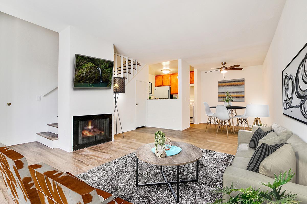 a living room filled with furniture and a fire place