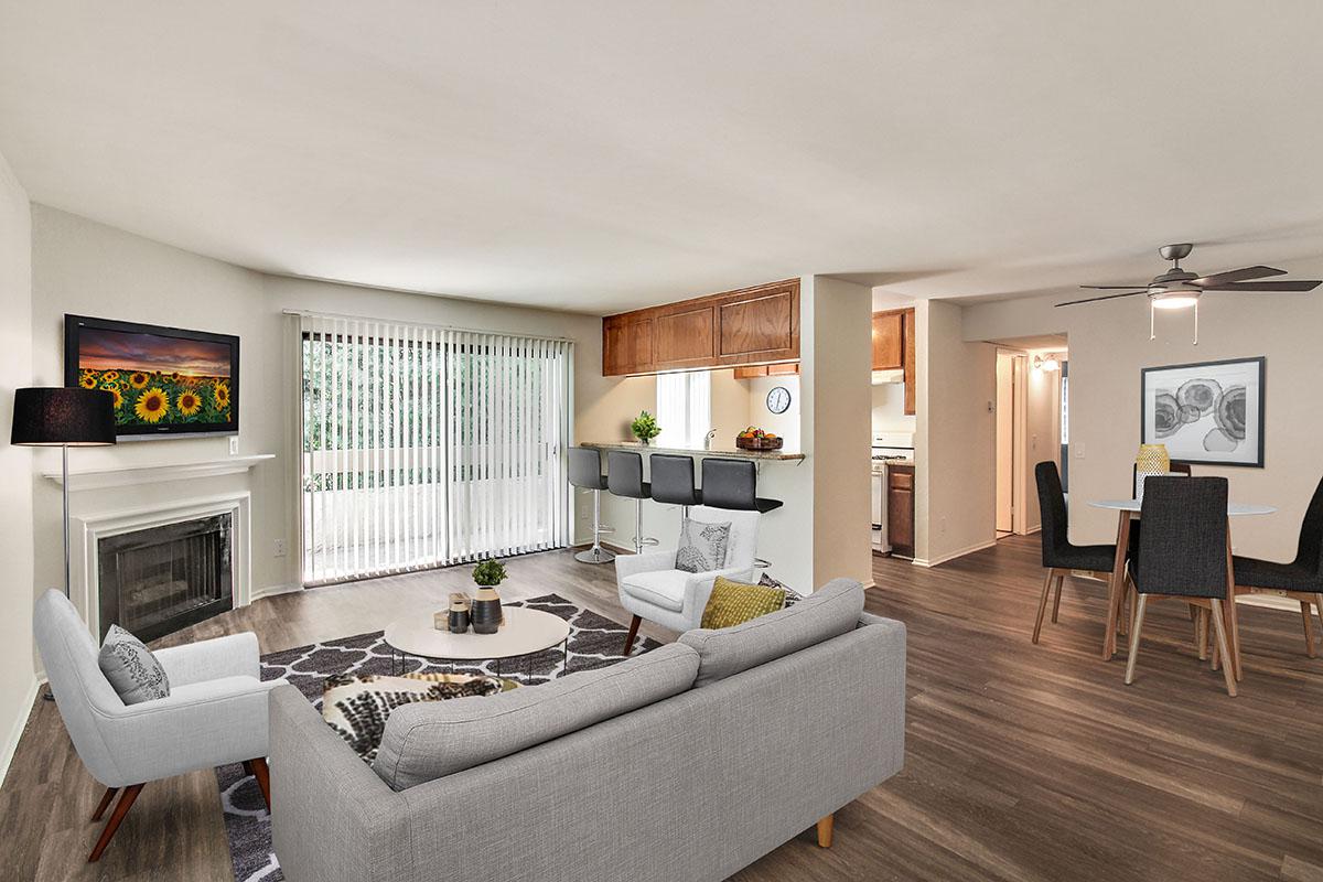 a living room filled with furniture and a fireplace