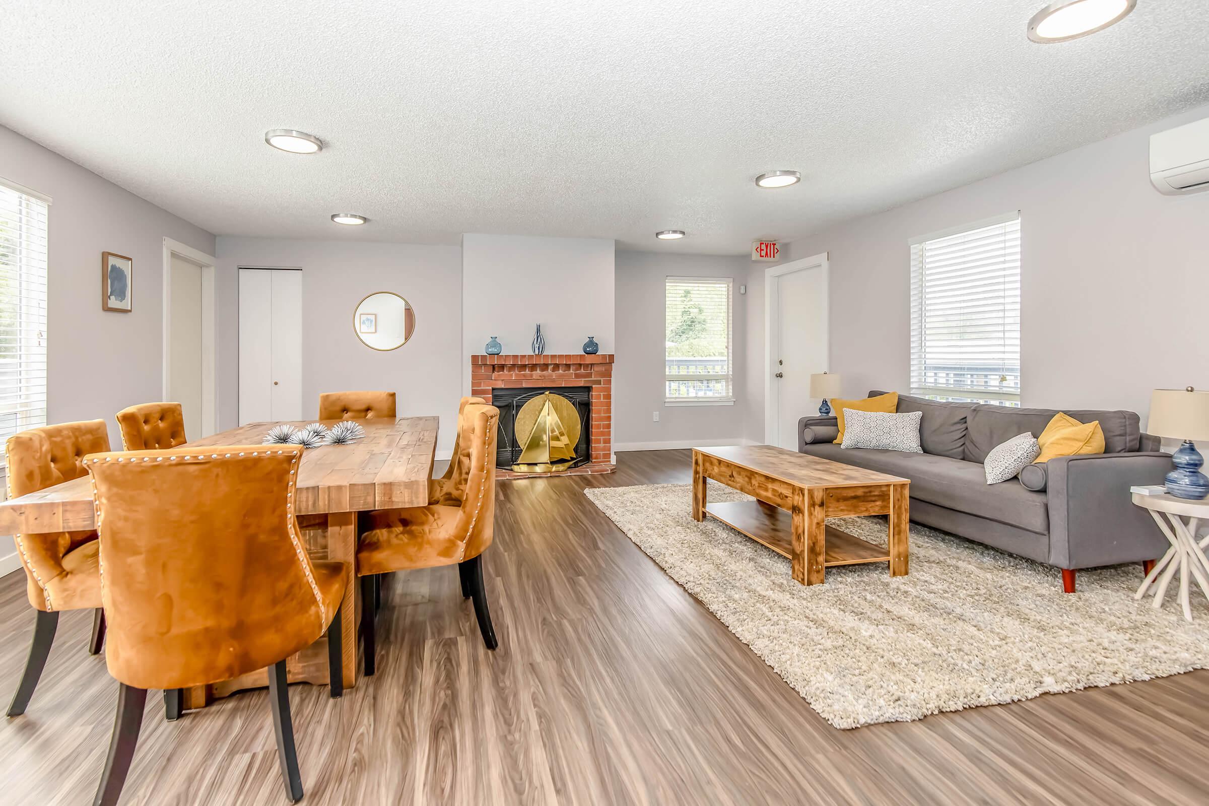 a living room filled with furniture and a flat screen tv