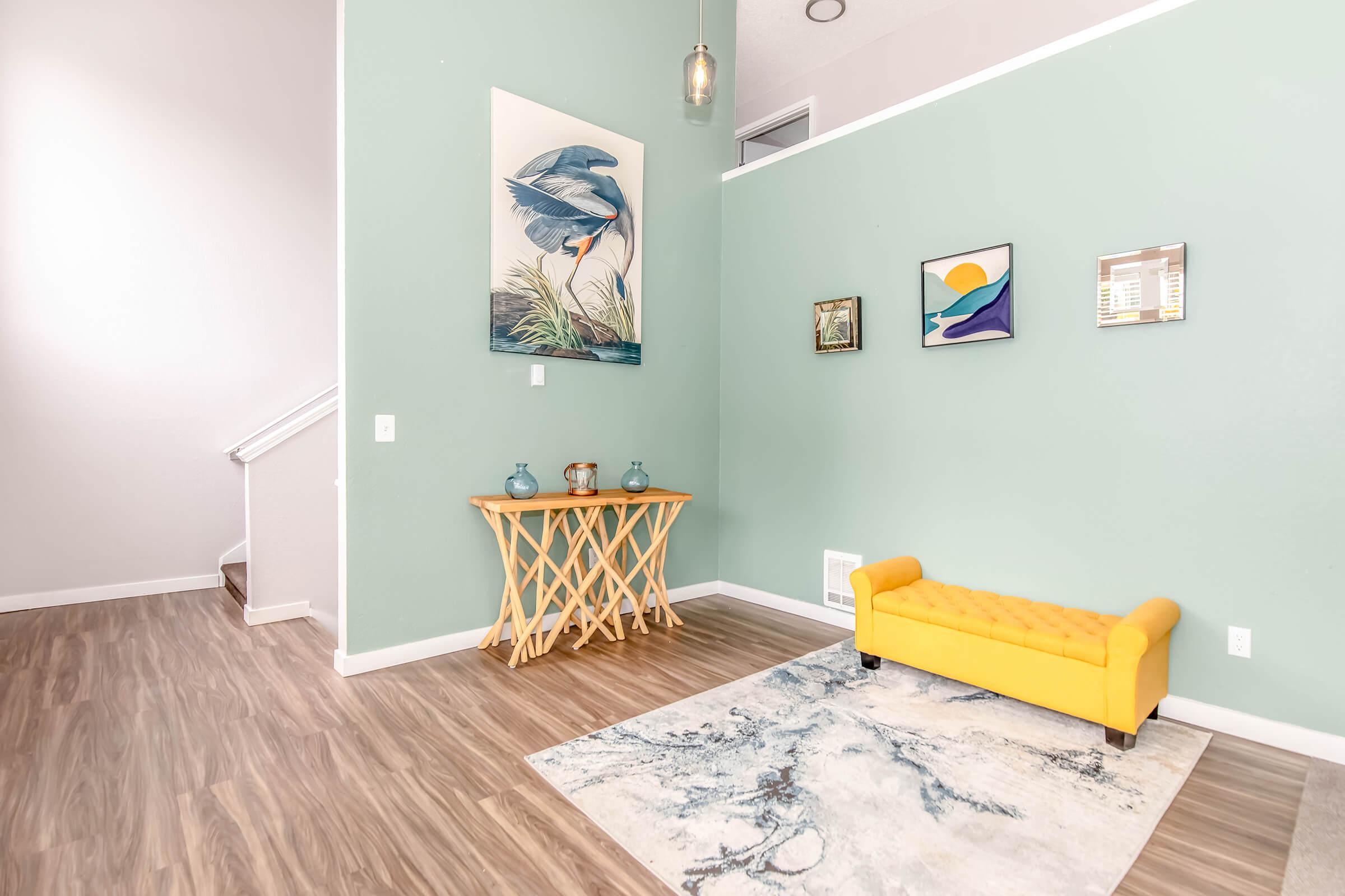 a bedroom with a wooden floor