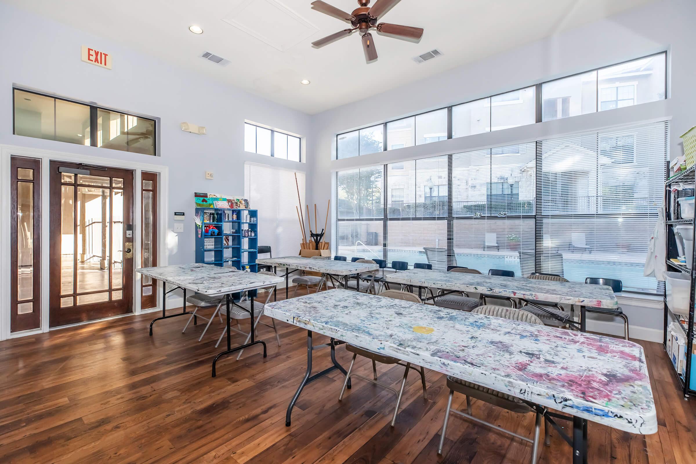 a room filled with furniture and a large window