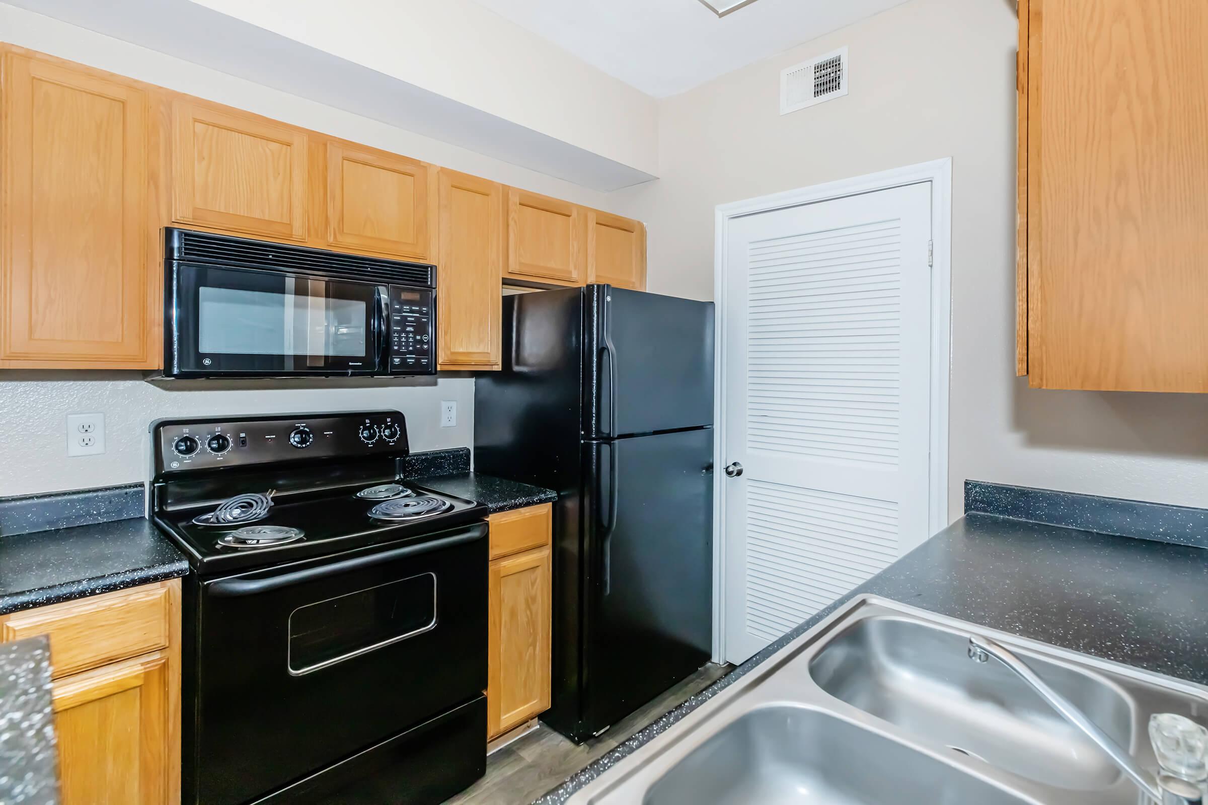 a kitchen with a stove and a microwave