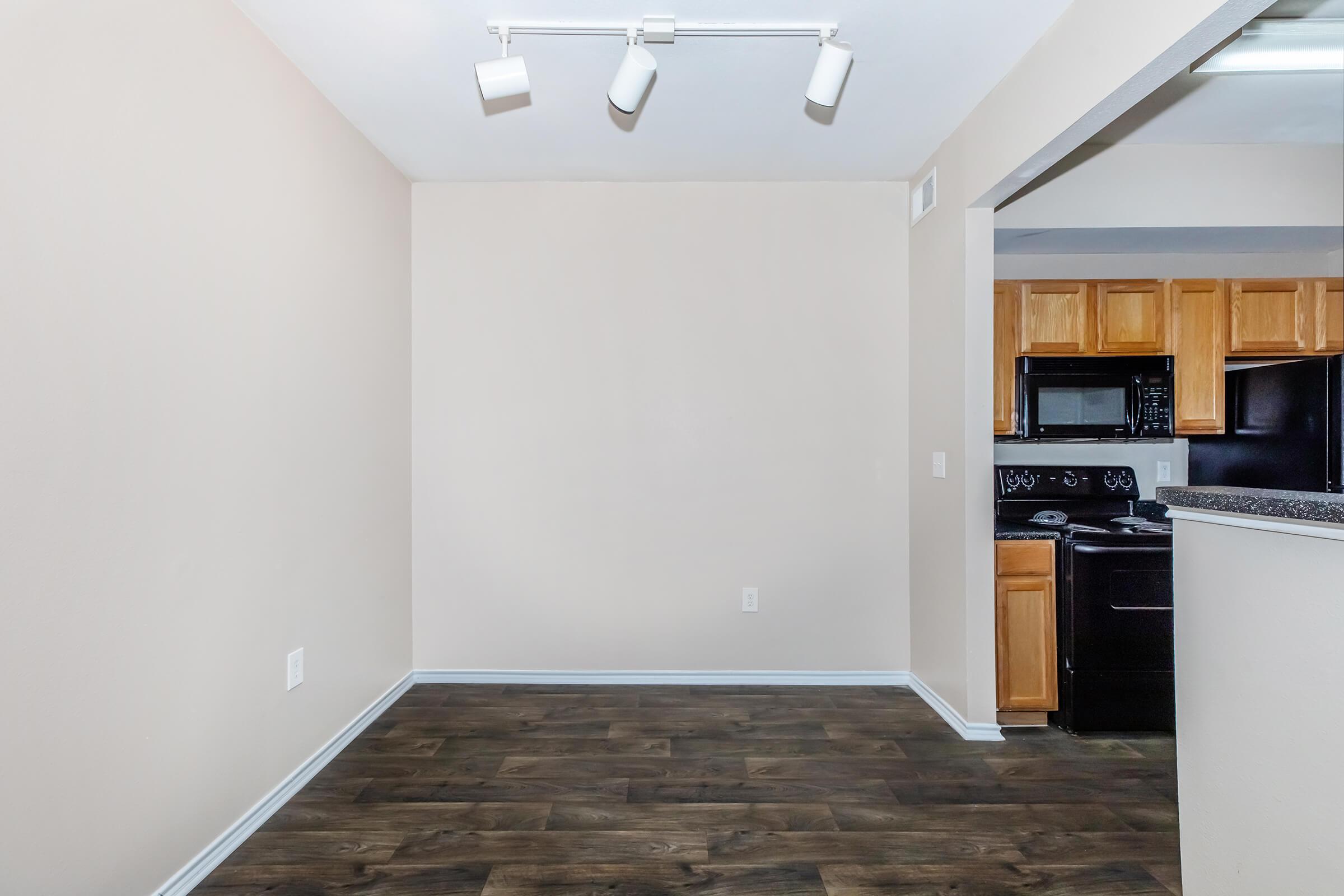 a kitchen with a wooden floor