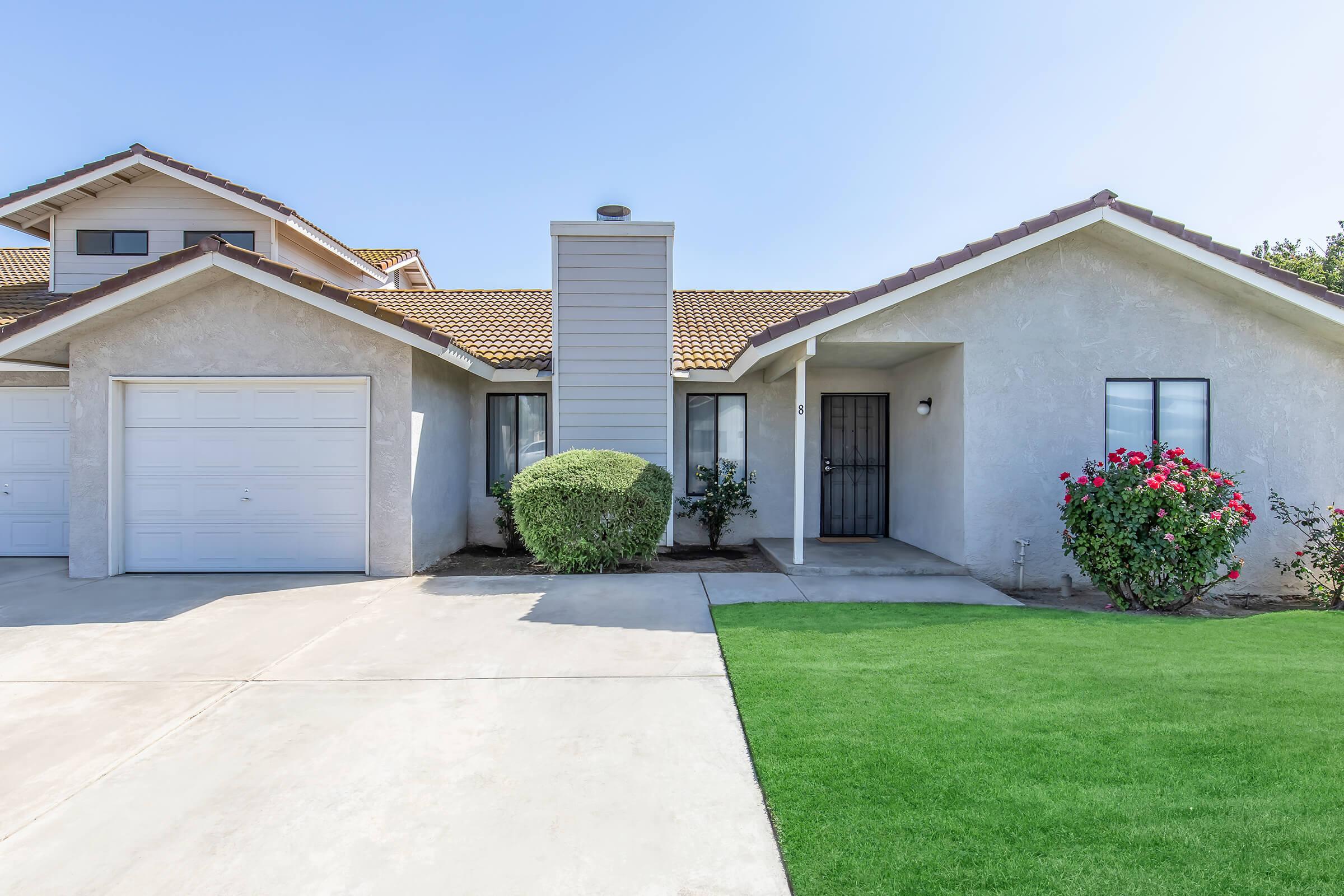 a large lawn in front of a house