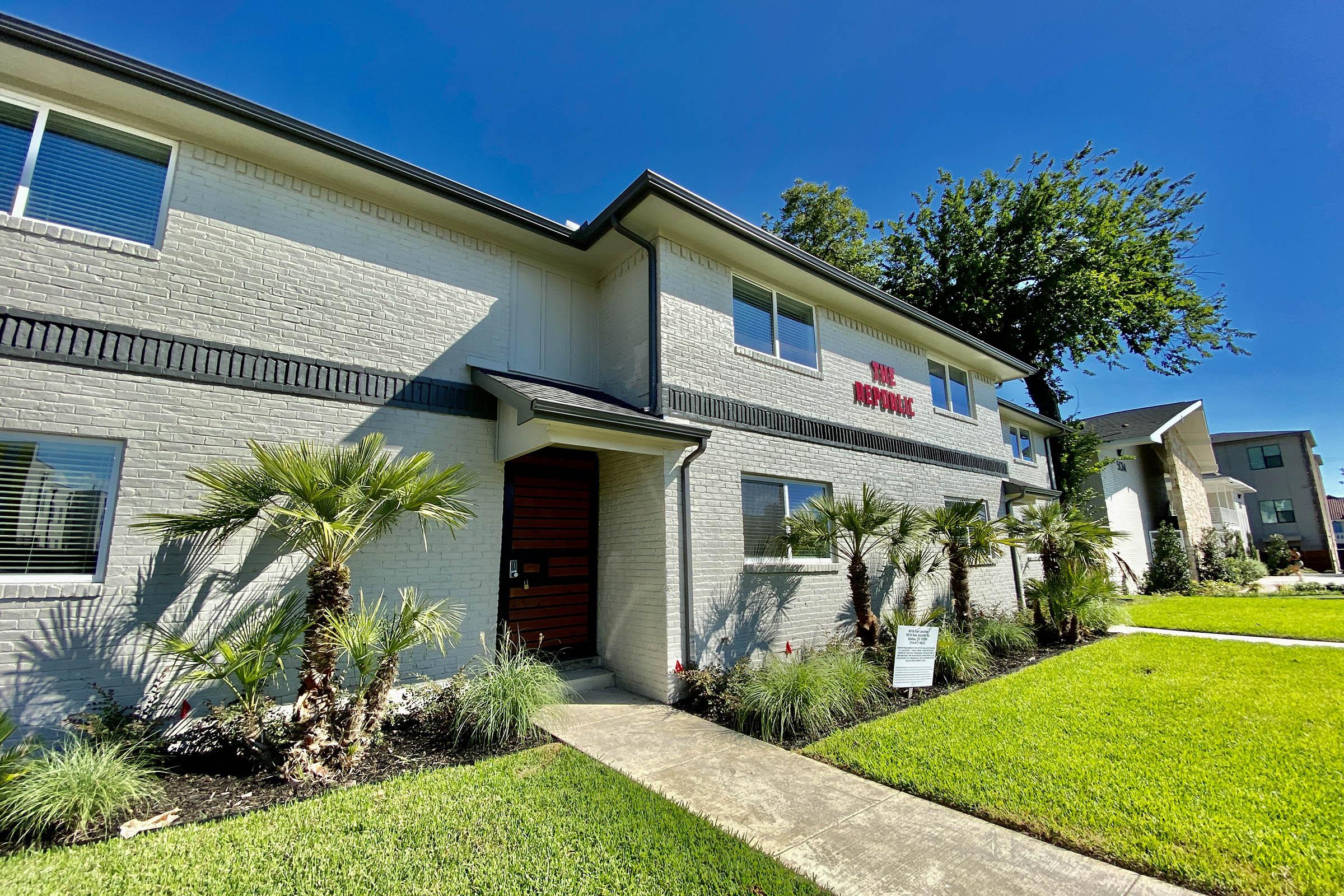 the community building with green grass