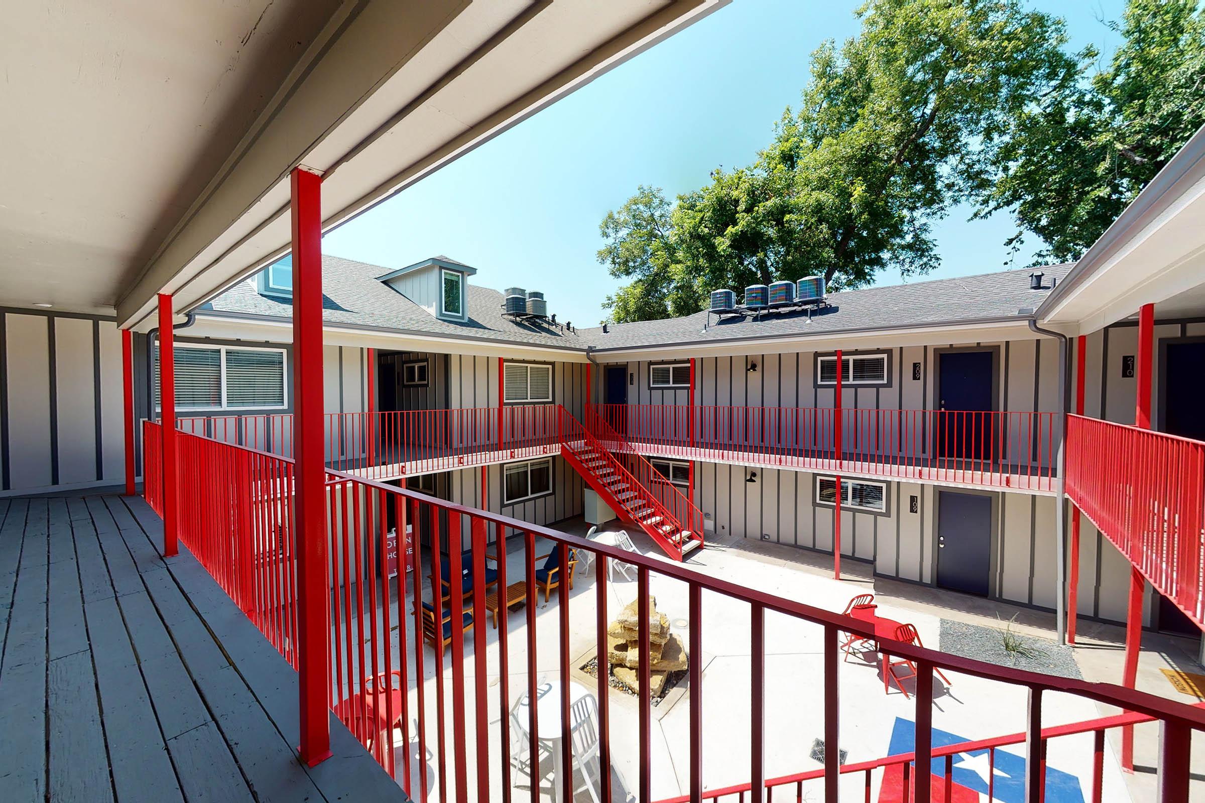 the community buildings with red fencing