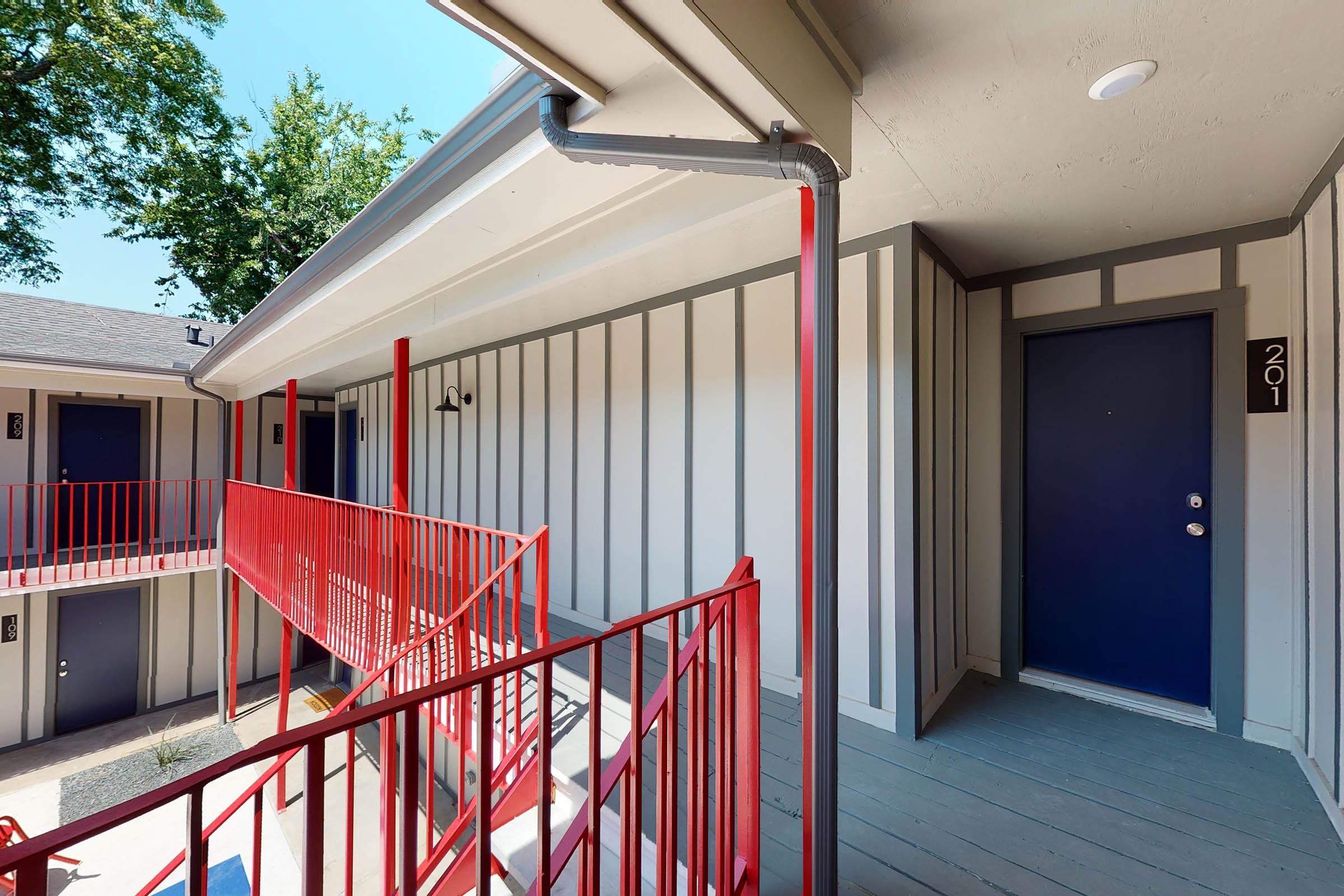 a community building with blue doors