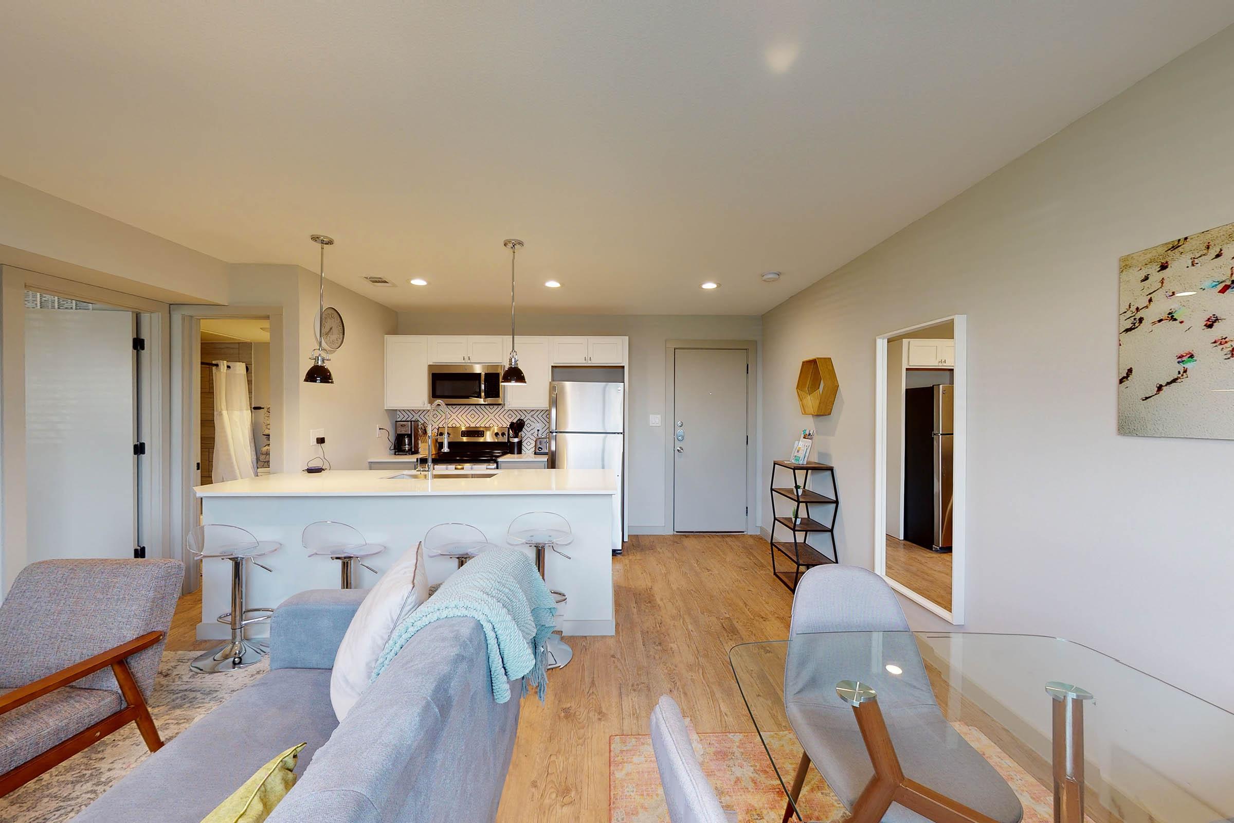 a furnished apartment with a glass table