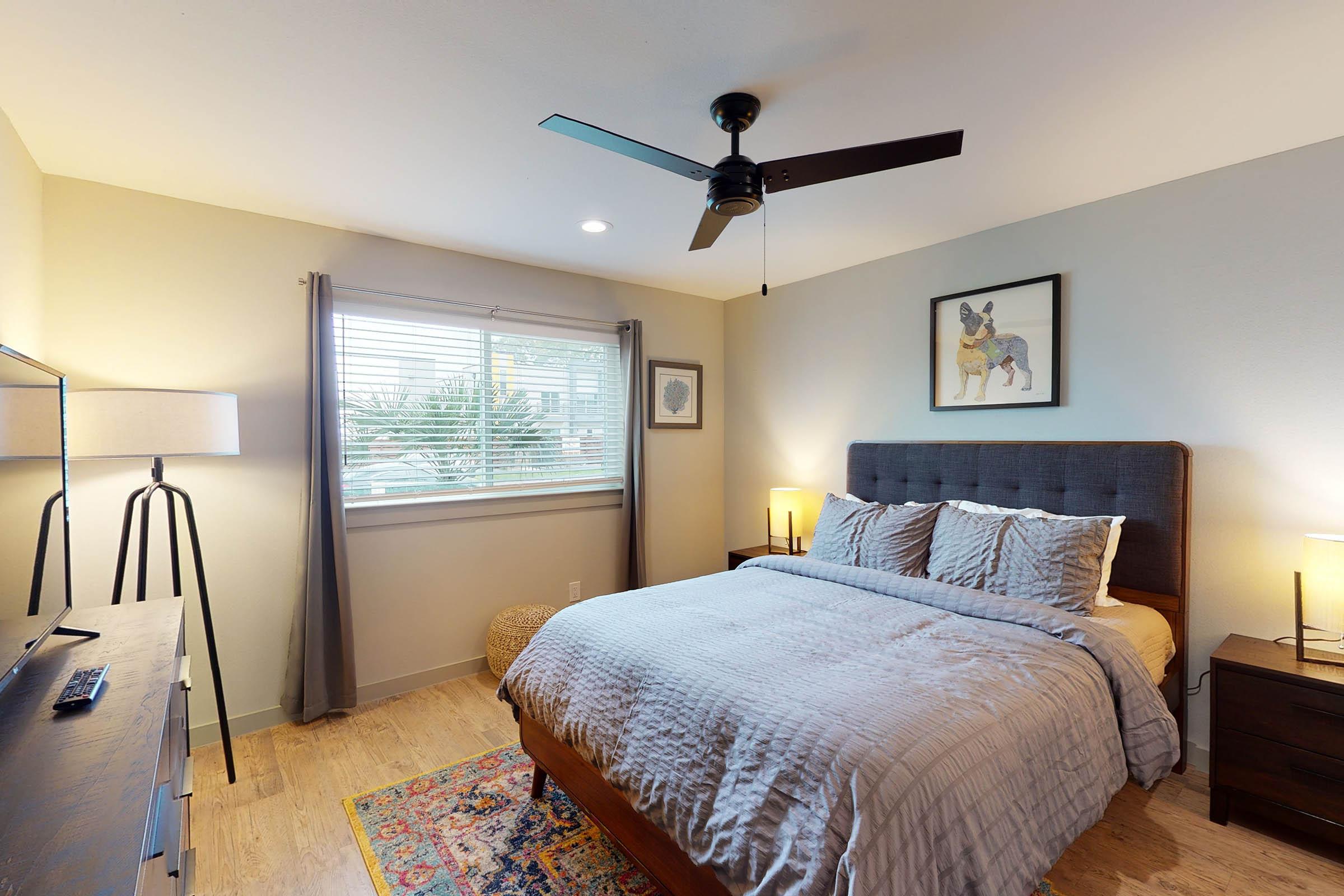 a furnished bedroom with an area rug