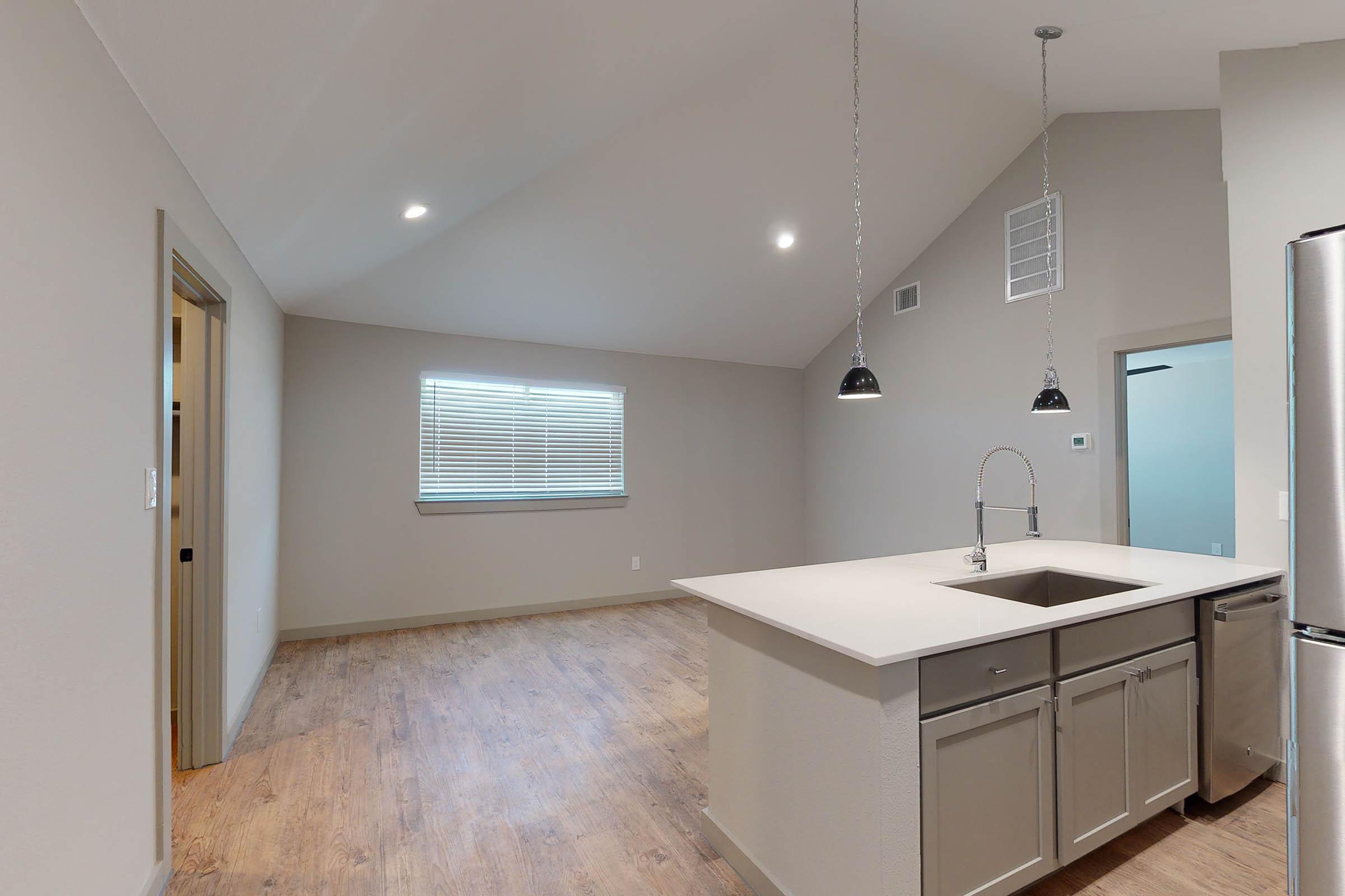 dining room and kitchen with wooden floors