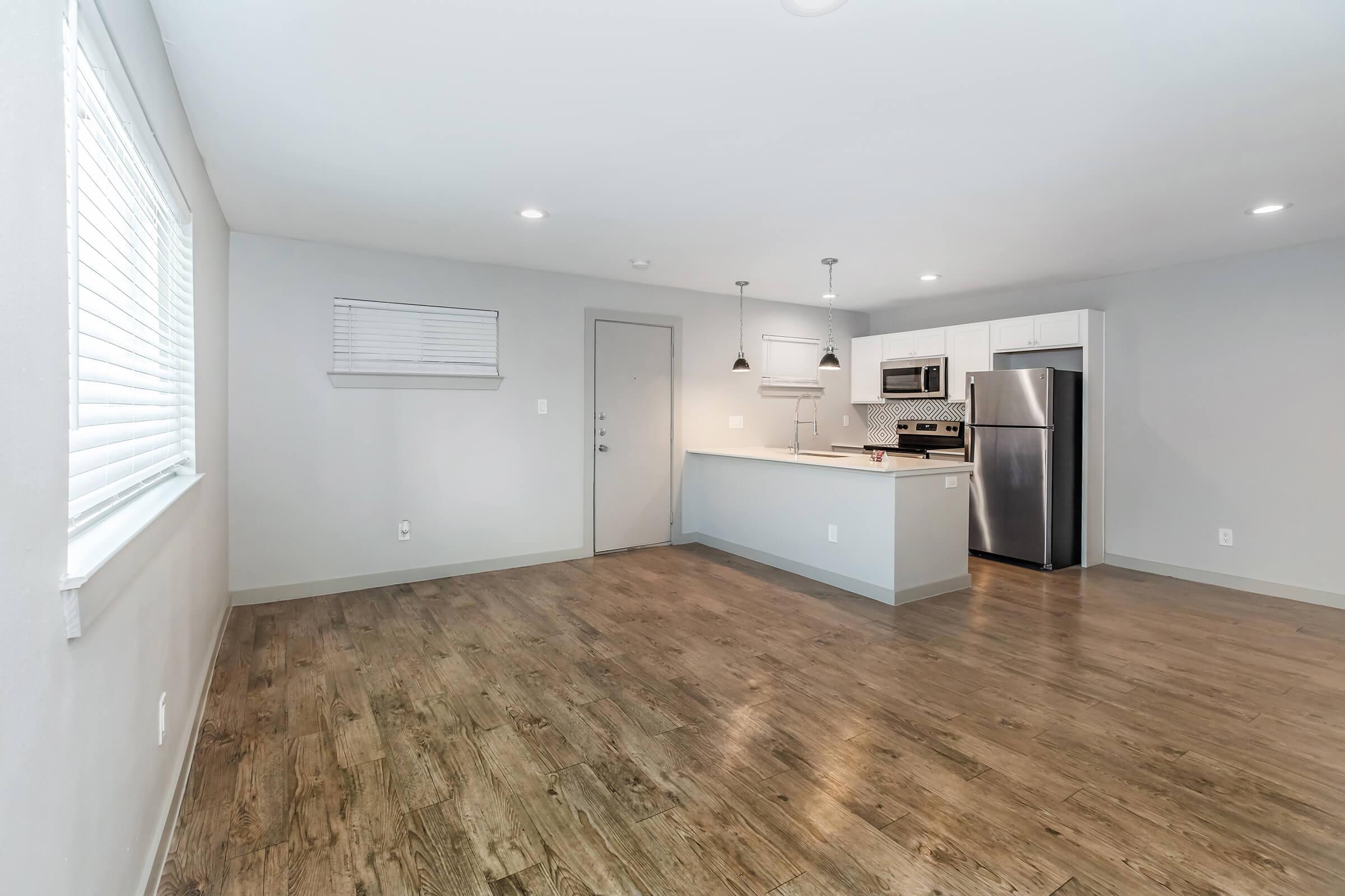 a kitchen with a wooden floor