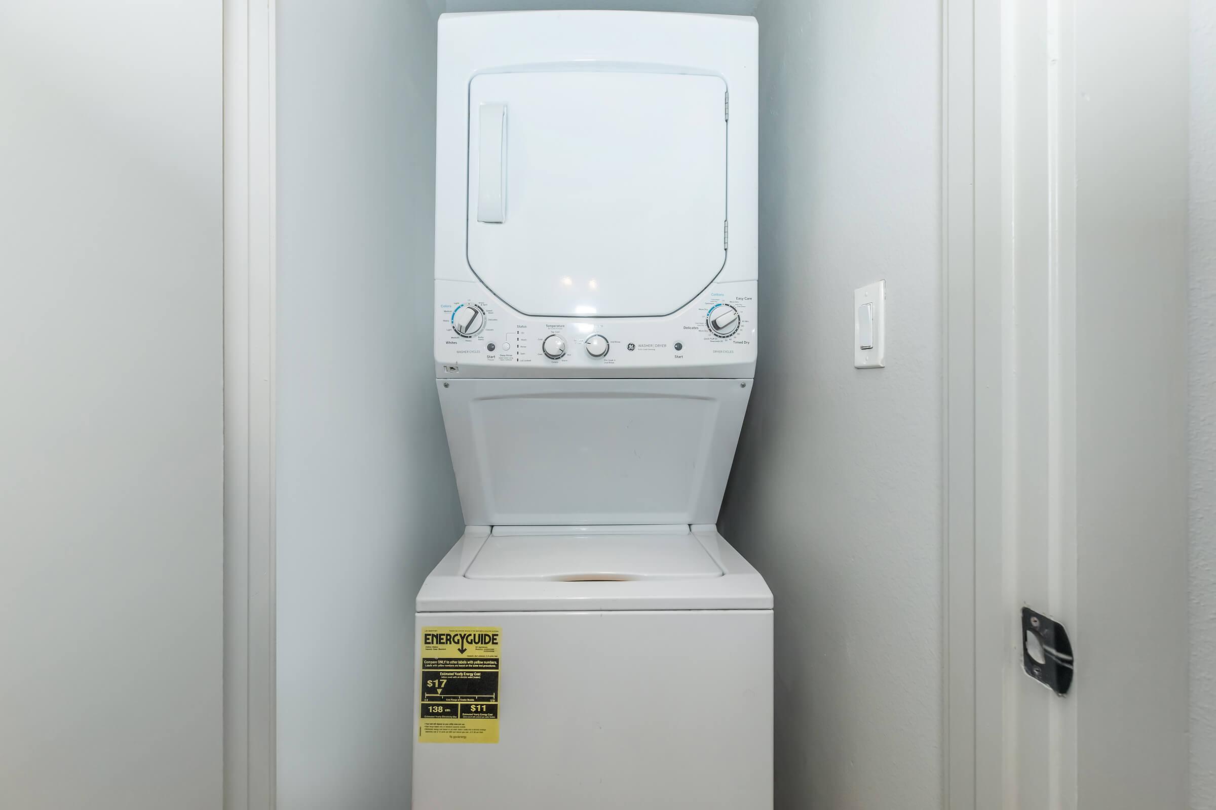 a microwave oven sitting on top of a refrigerator