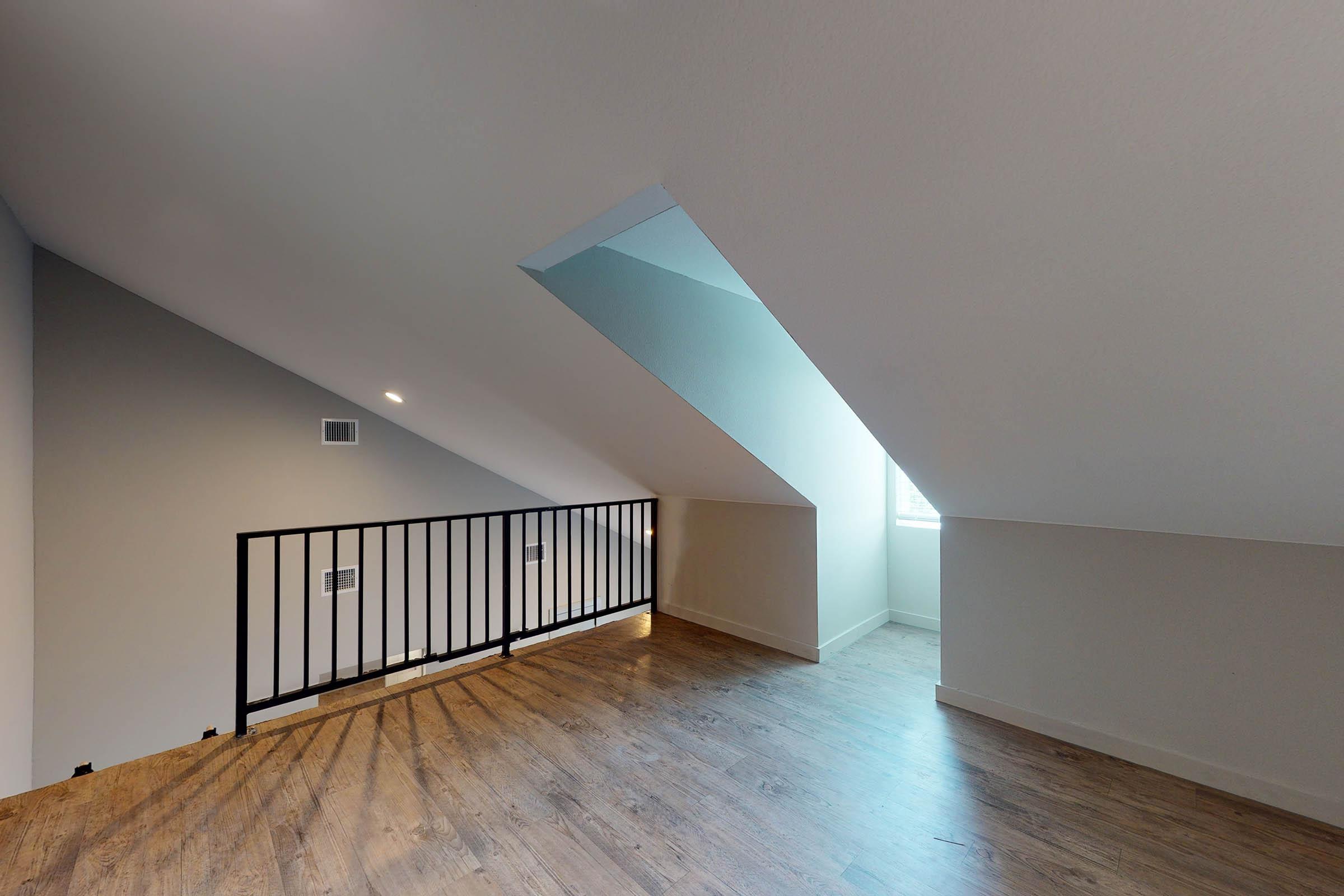 a loft with a black fence