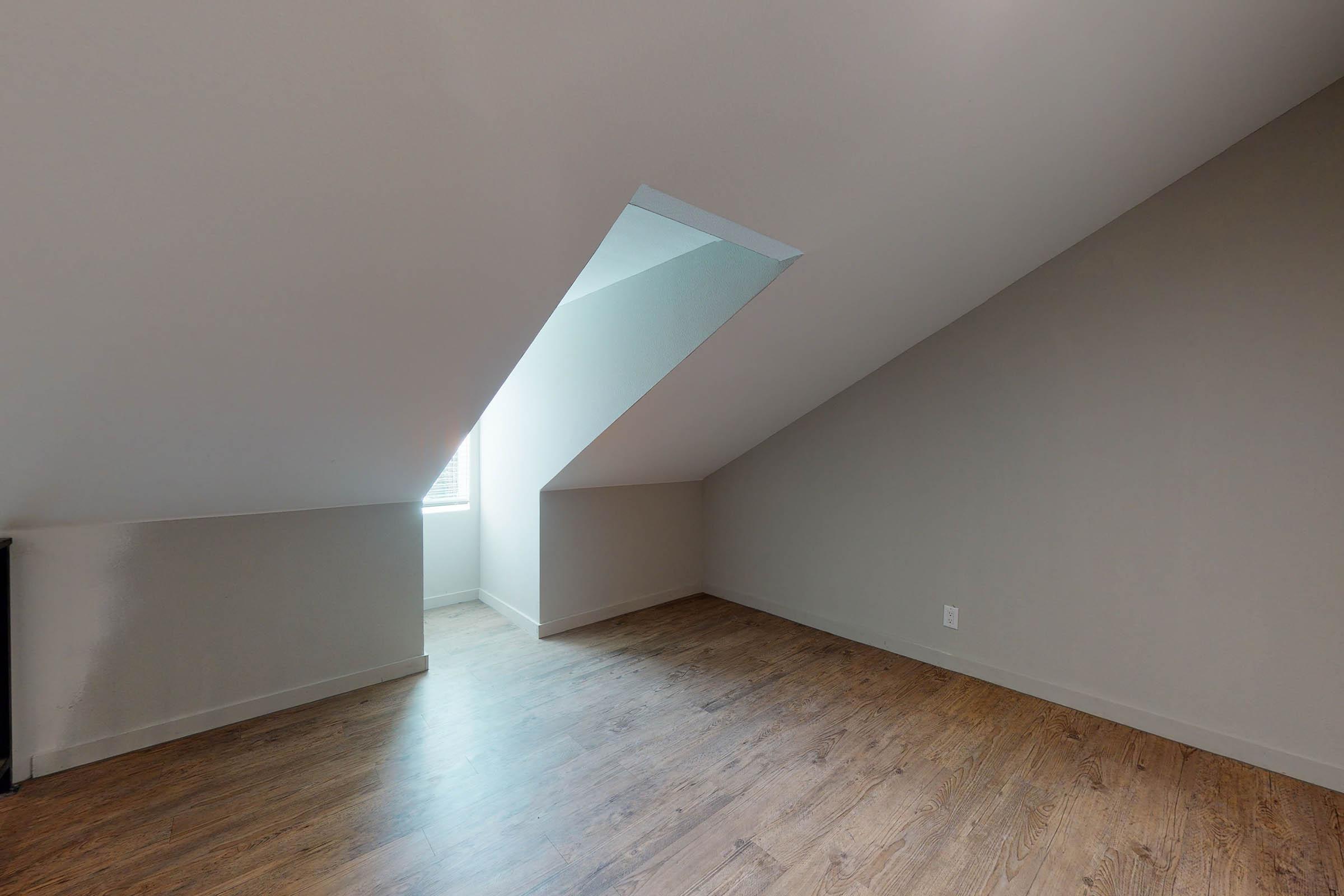 a loft with wooden floors