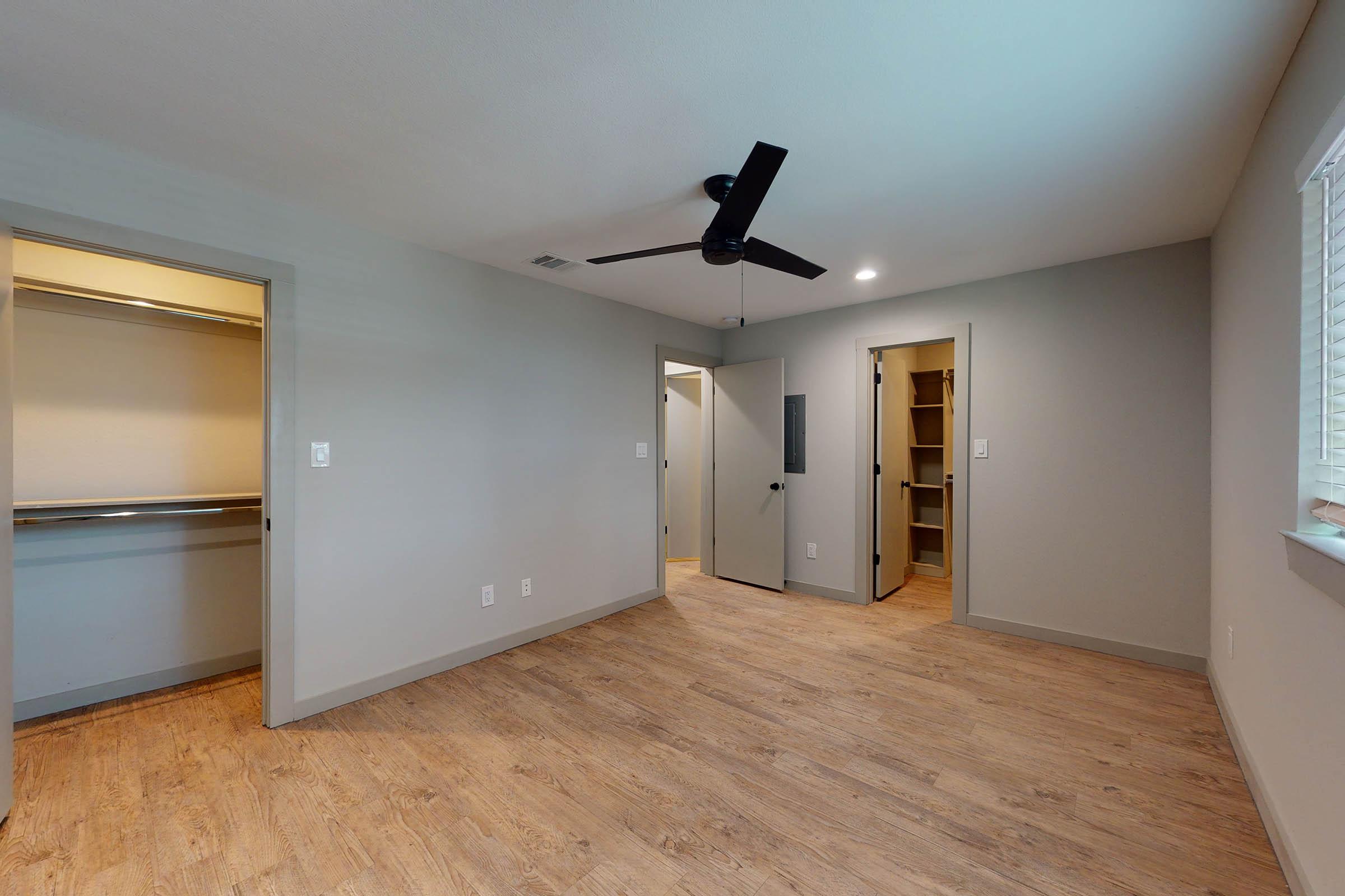 a bedroom with attached bathroom and closet