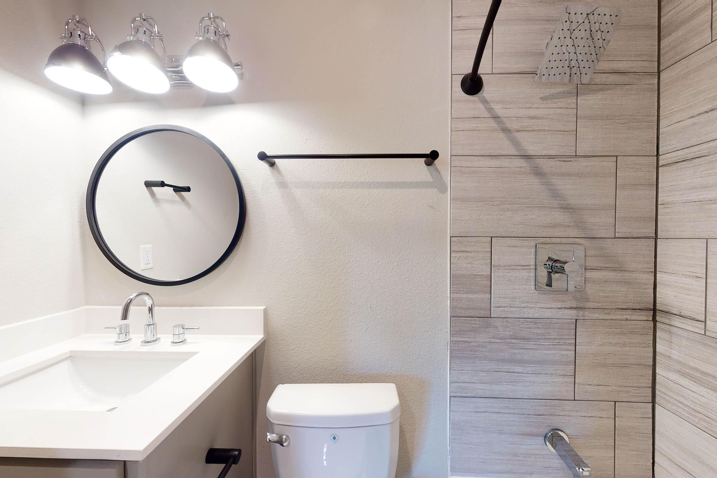 a close up of a sink and a mirror