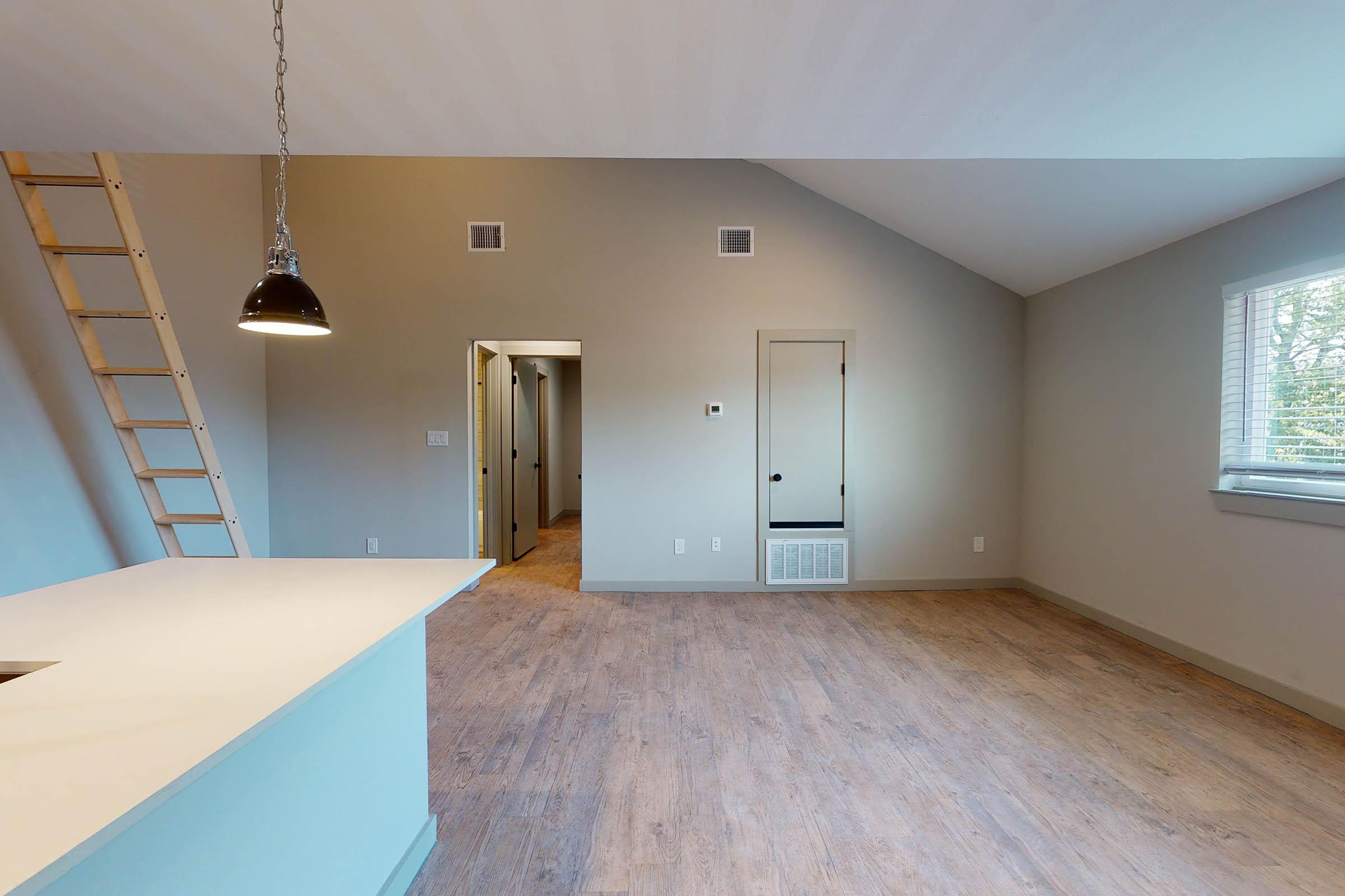 a dining room with stairs