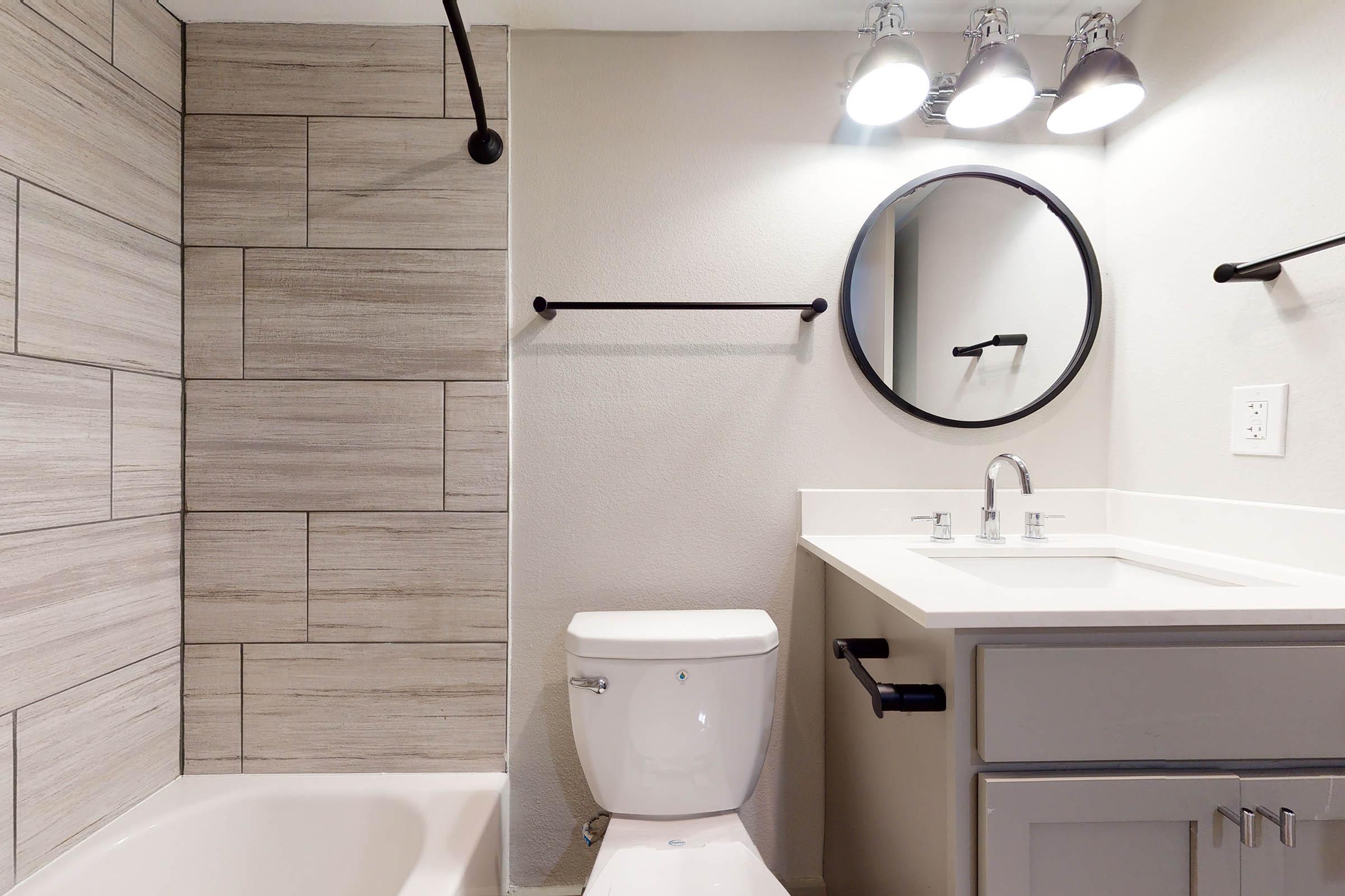 an unfurnished bathroom with a wooden cabinet