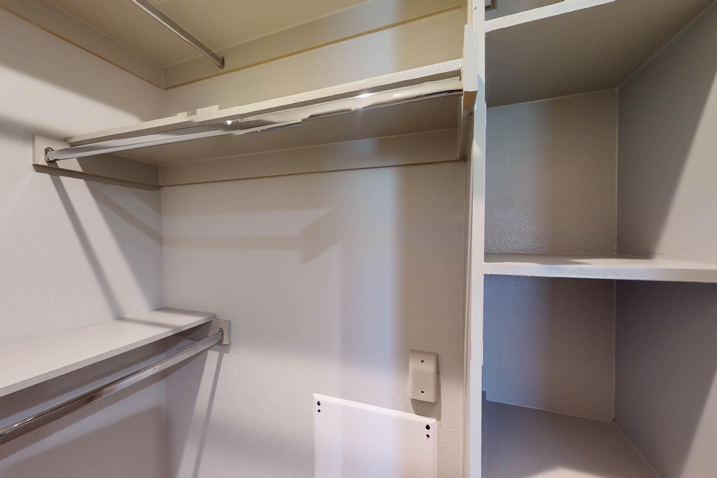 an unfurnished walk-in closet