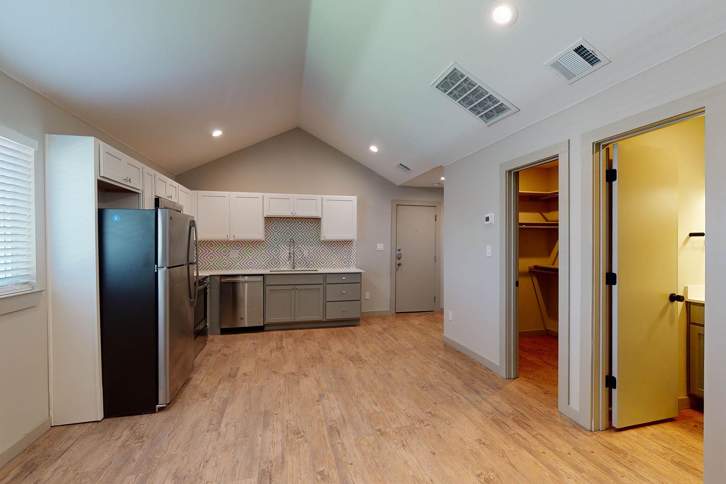 a vacant apartment with wooden floors 