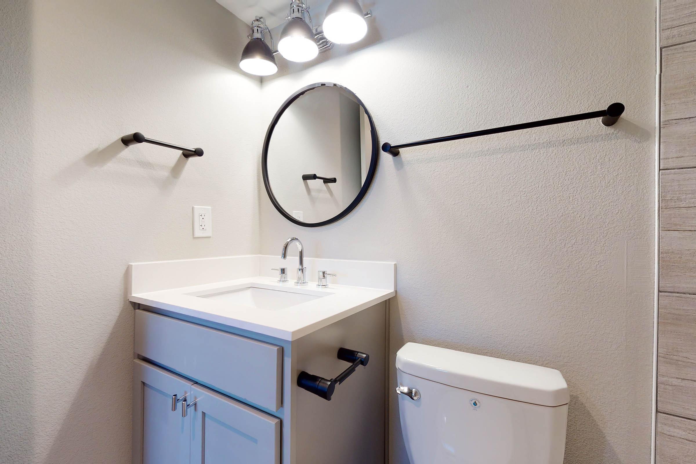 vacant bathroom with a white sink