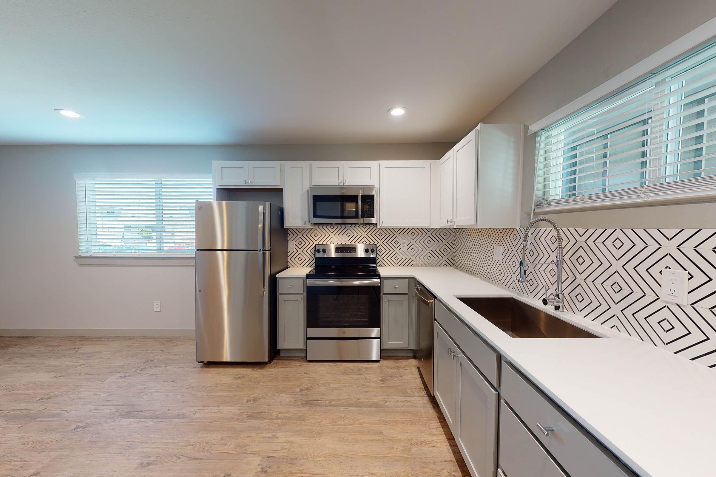 vacant kitchen with stainless steel appliances