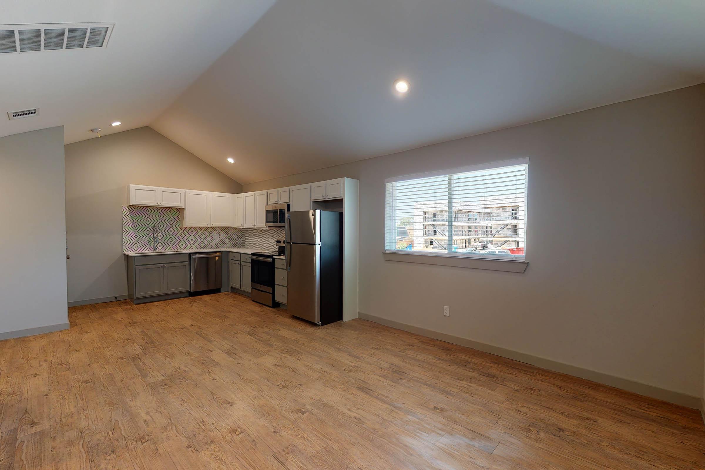 living room and kitchen with wooden floors