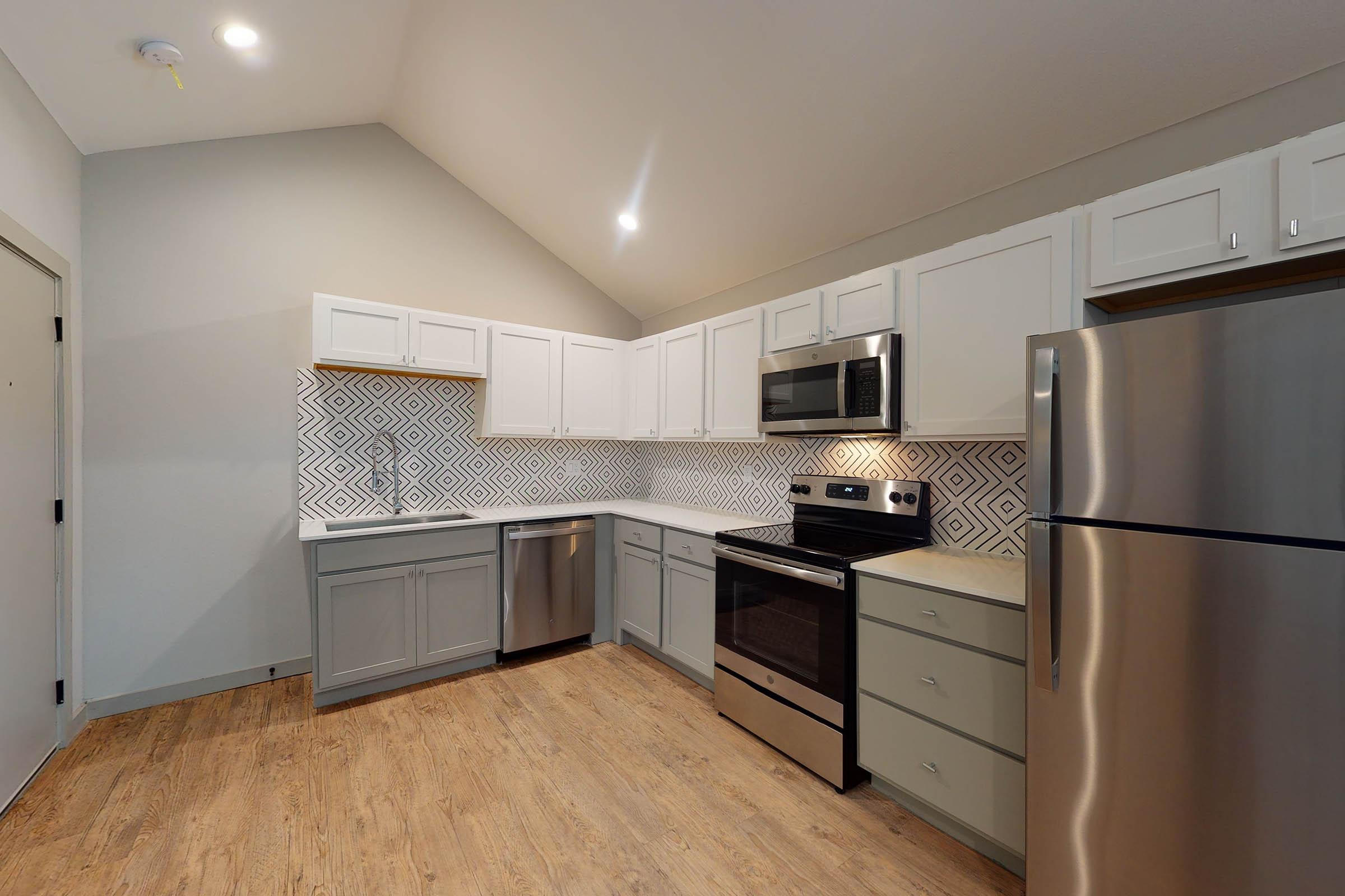 kitchen with wooden cabinets and floors