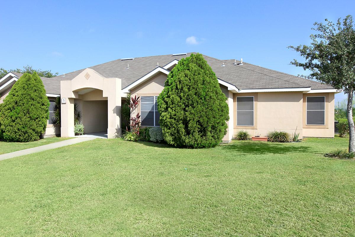 a large lawn in front of a house