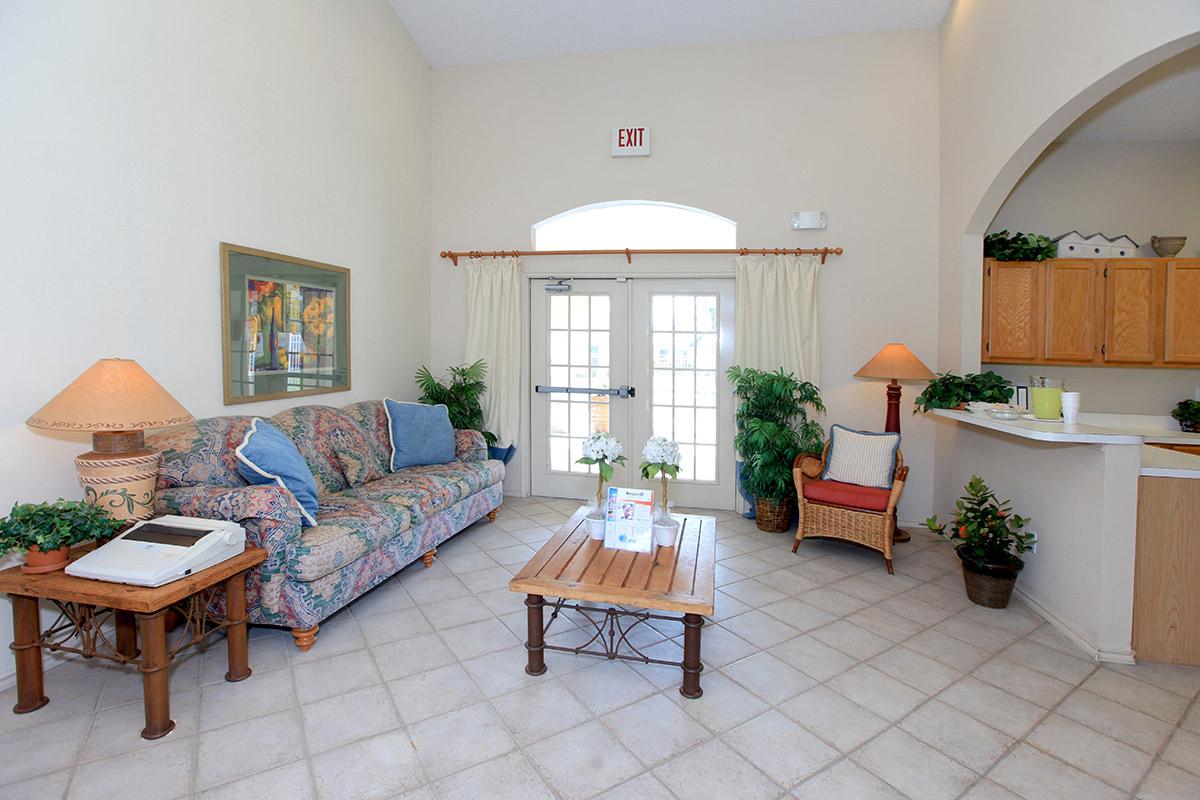 a living room filled with furniture and a fireplace