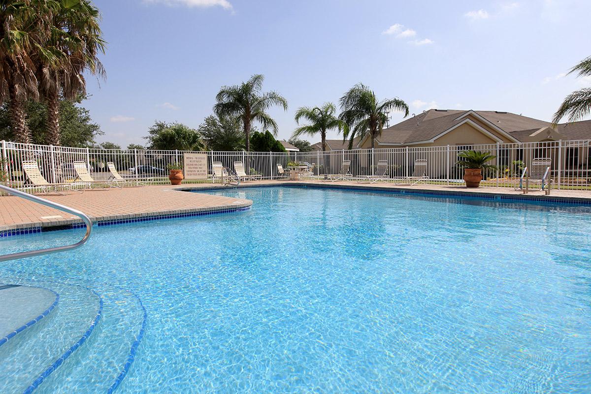 a pool next to a body of water