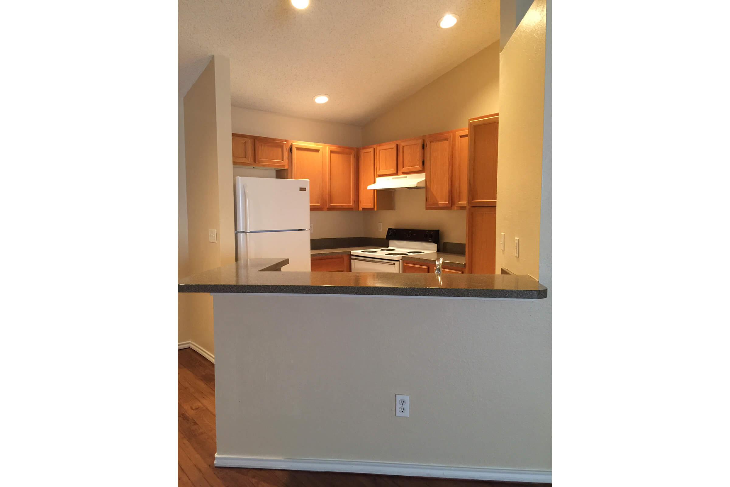 a kitchen with a sink and a refrigerator